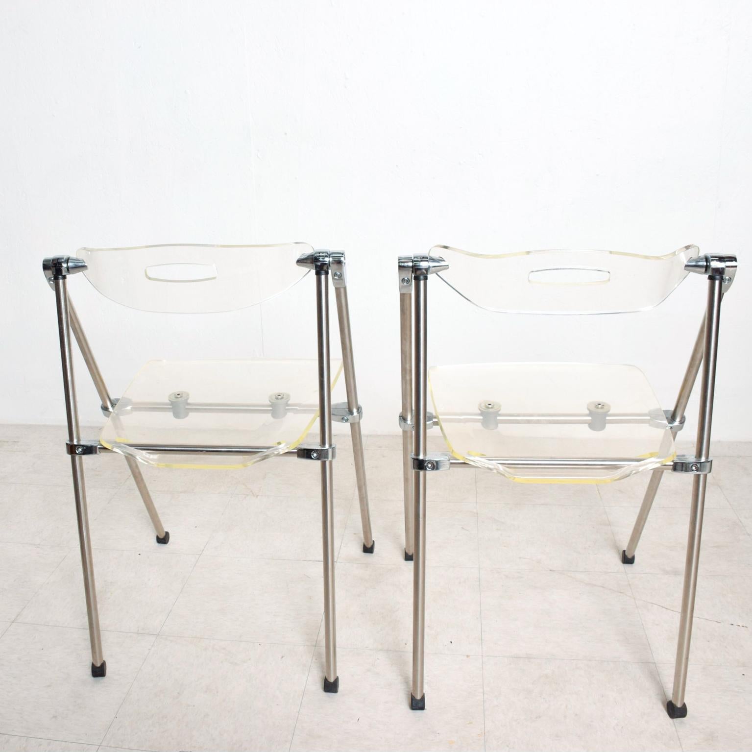 For Your Consideration: Mid Century Modern Italy 1960s Pair of Lucite Folding Chairs  Attributed to G. Piretti for Castelli.
Reference # SEATGM1213196 Chairs are an amazing Classic Modern Italian Design in Modern Lucite and Chrome.
Dimensions are: