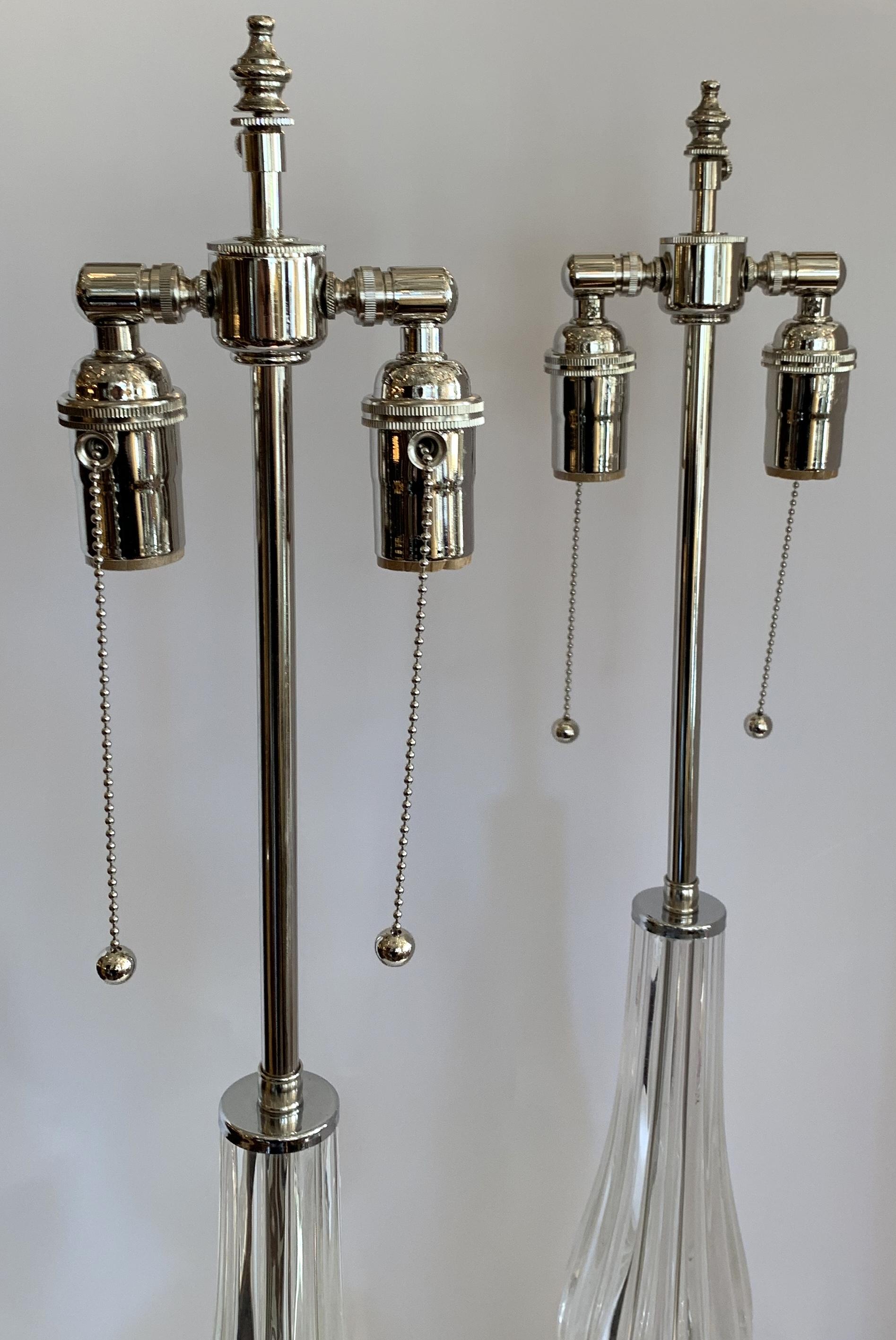 A wonderful pair of Mid-Century Modern Italian Murano Seguso style Venetian clear fluted glass lamps in the Art Deco style with new polished nickel fittings and wiring.
Purchased from Lorin Marsh.