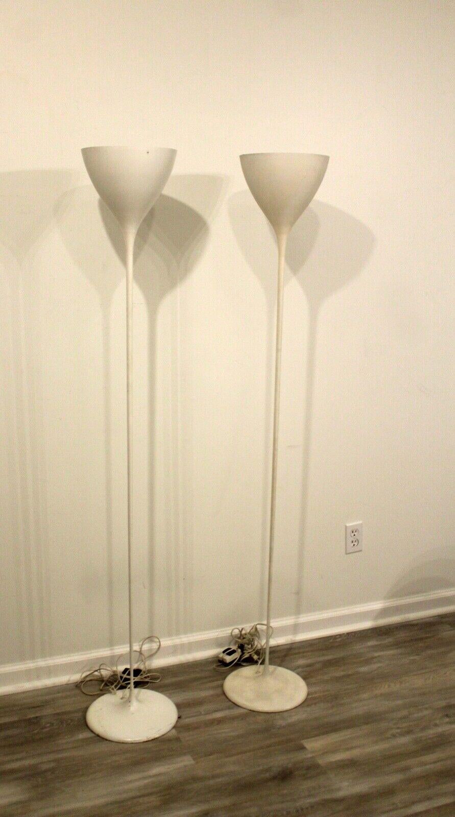 We present a pair of iconic white metal torchiere lamps by swiss designer Max Bill, circa 1960's. In very good condition. Dimensions: 11.5