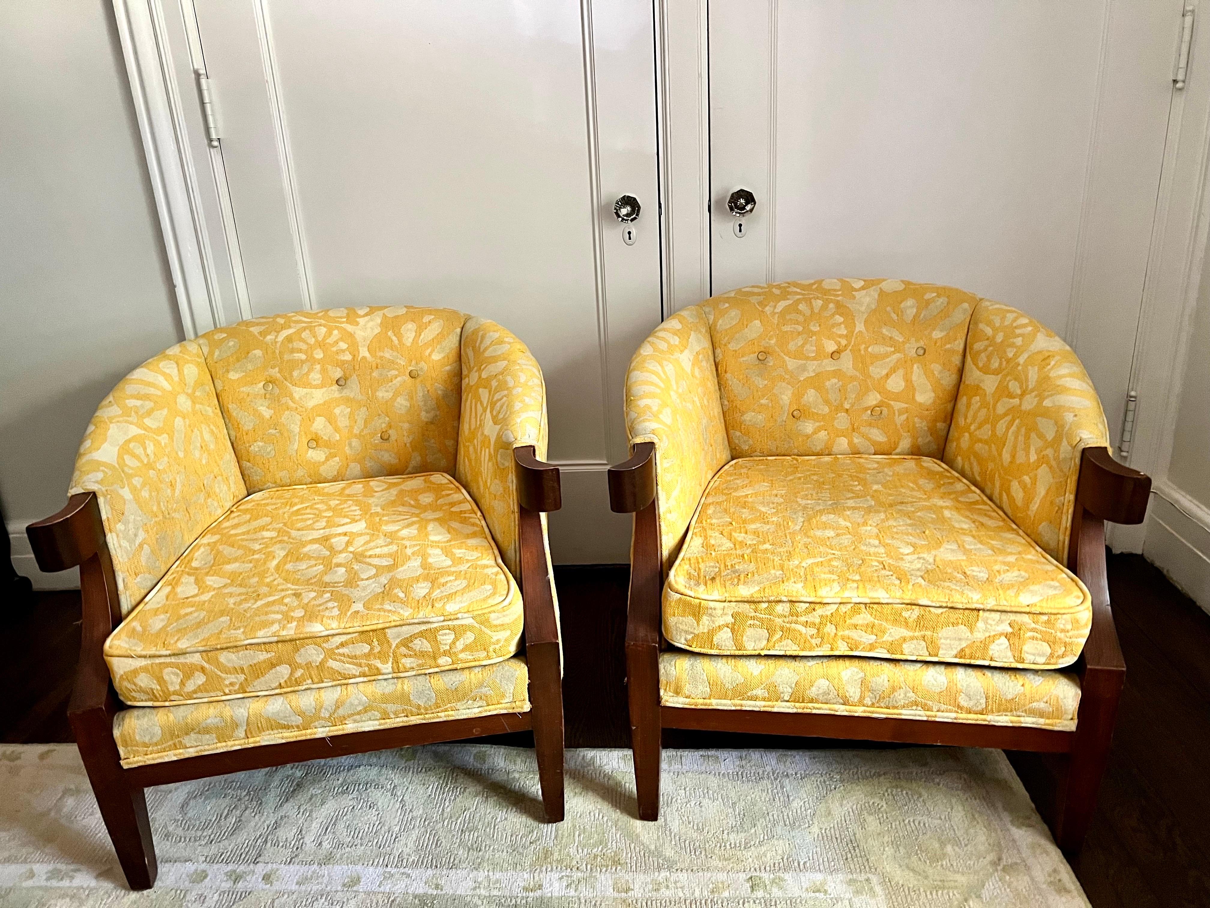 Vintage mid century barrel back chairs with original yellow floral print upholstery. The fabric has age appropriate wear as one would expect. Add a pop of brightness to your decor! Set your home apart with Revival Home.
