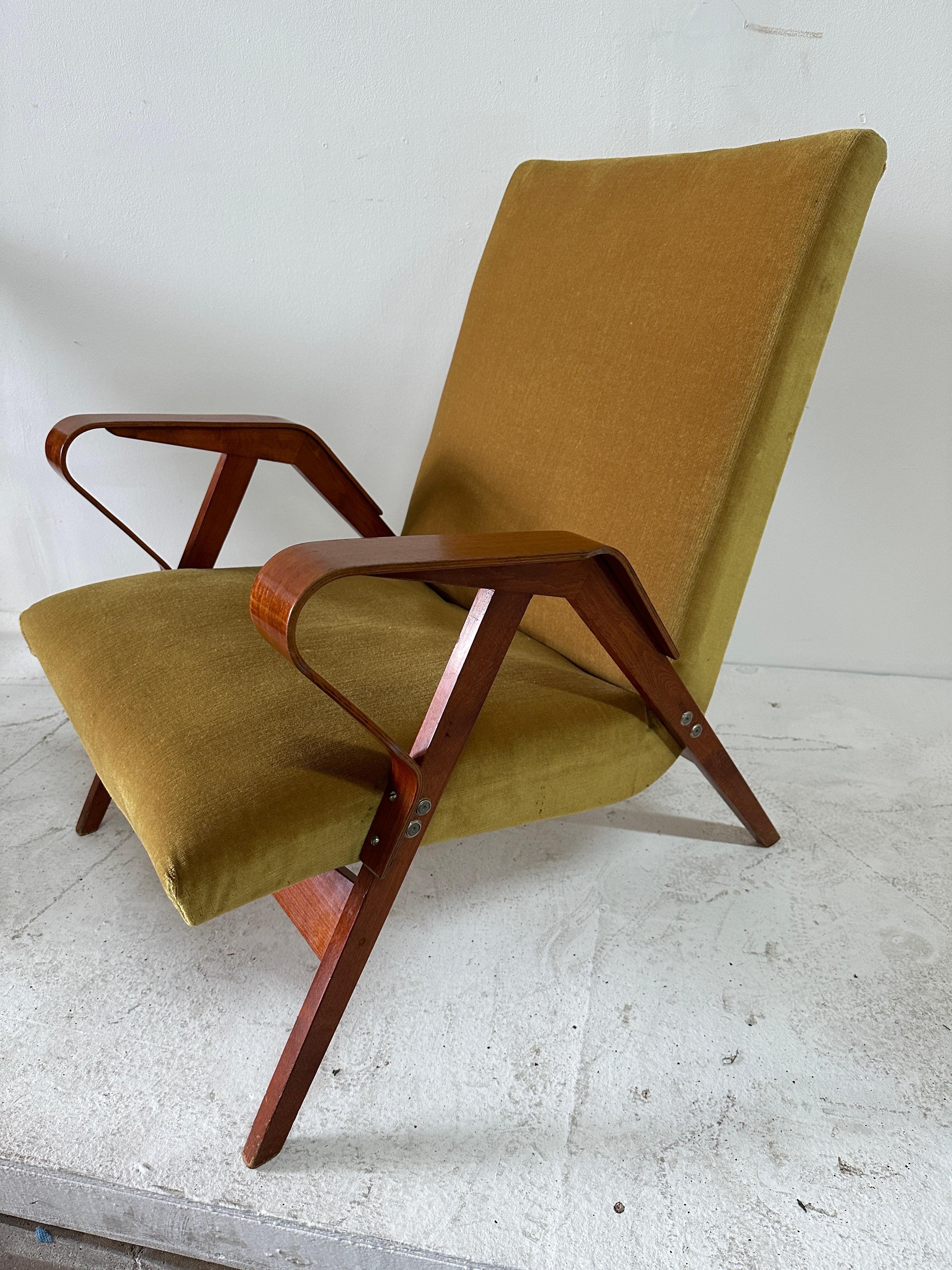 These very chic Czechoslovakian mid-century modern armchairs with bent wood frame in slats and geometric curves.  VERY VERY comfortable and perfect lounge chairs.  NOTE: THIS ITEM IS LOCATED AND WILL SHIP FROM OUR MIAMI, FLORIDA SHOWROOM.