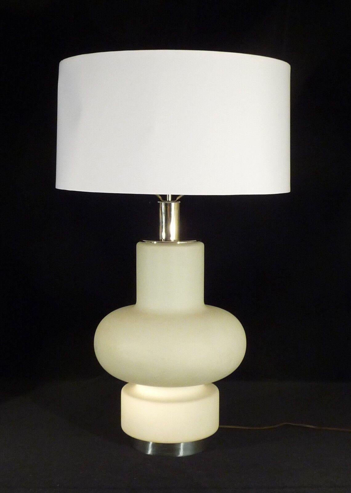For your consideration is this pair of large and impressive Italian mid-century modern sculptural frosted white glass column table lamps with nickel accented elements. Designed by Bobo Piccoli for Laurel Lamp Co in the 1970s 
In very good vintage