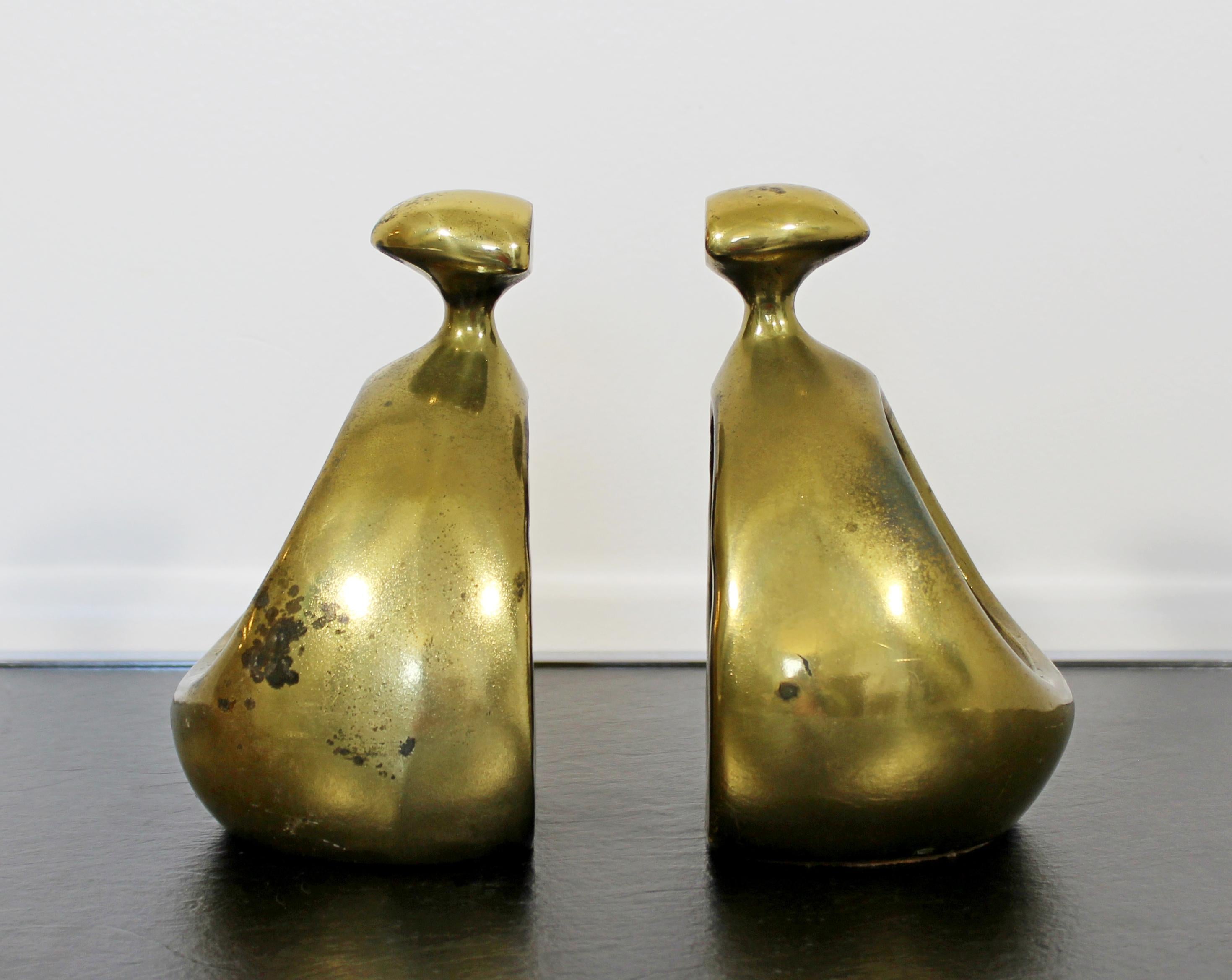 For your consideration is a wonderful pair of bookends, made brass, by Ben Siebel, circa the 1950s. In good vintage condition, with a patina to match the age. The dimensions of each are 5