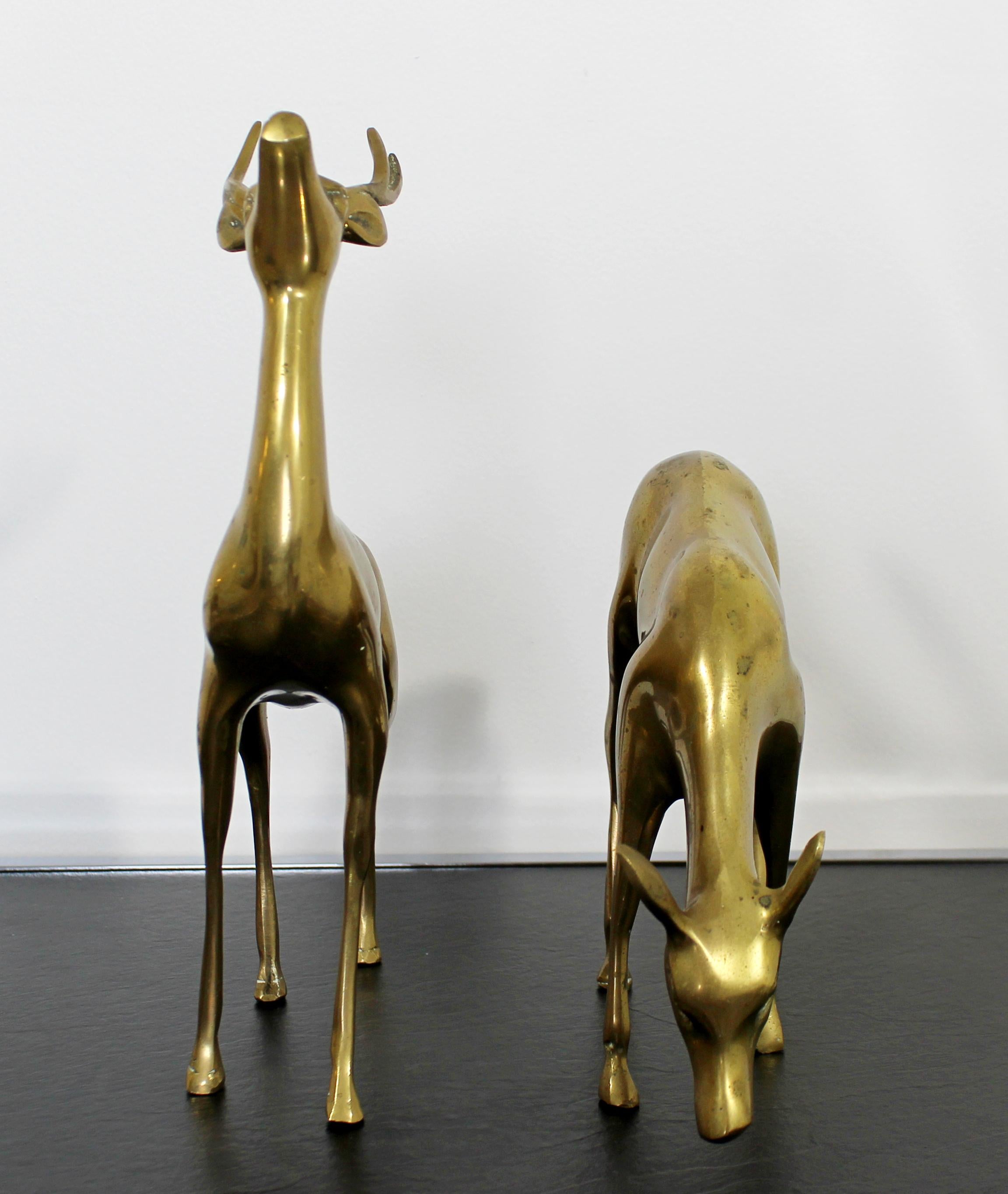 For your consideration is a fantastic pair of deer table sculptures, made brass, circa 1950s. In excellent vintage condition. The dimensions of are 8