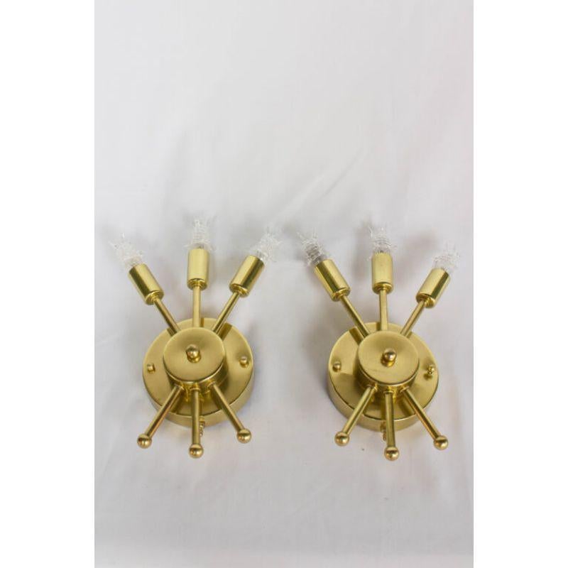 Three Light Sputnik Sconces. Includes bulbs. Round backplate with round step up center. Three arms with the illusion of passing through the center of the sconce. Sits relatively flat to the wall. All solid brass. Similar in quality to Lightolier but