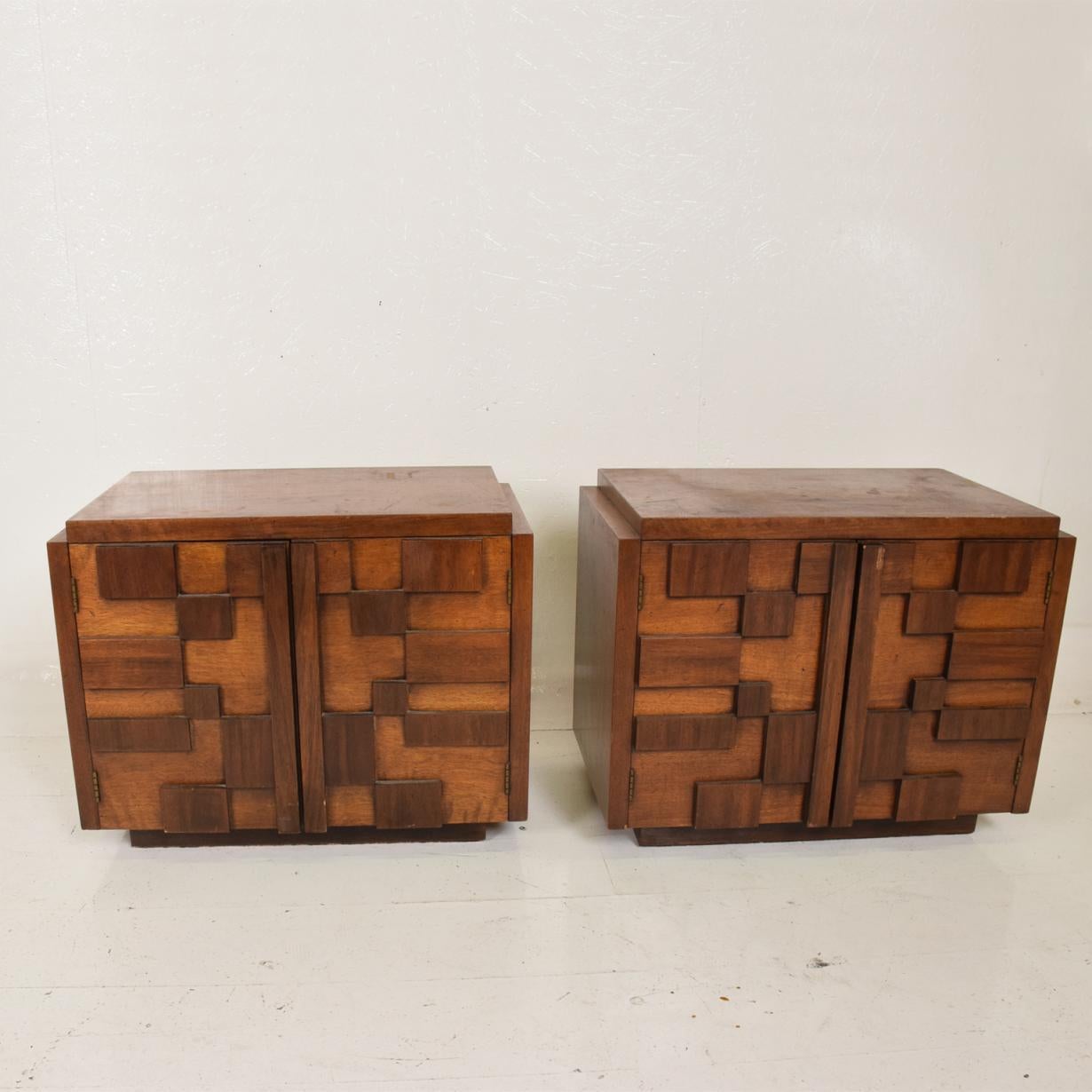 For your consideration, a pair of Brutalist walnut nightstands by Lane after Milo Baughman.


The USA, circa the 1970s.


Dimensions: 27 1/2