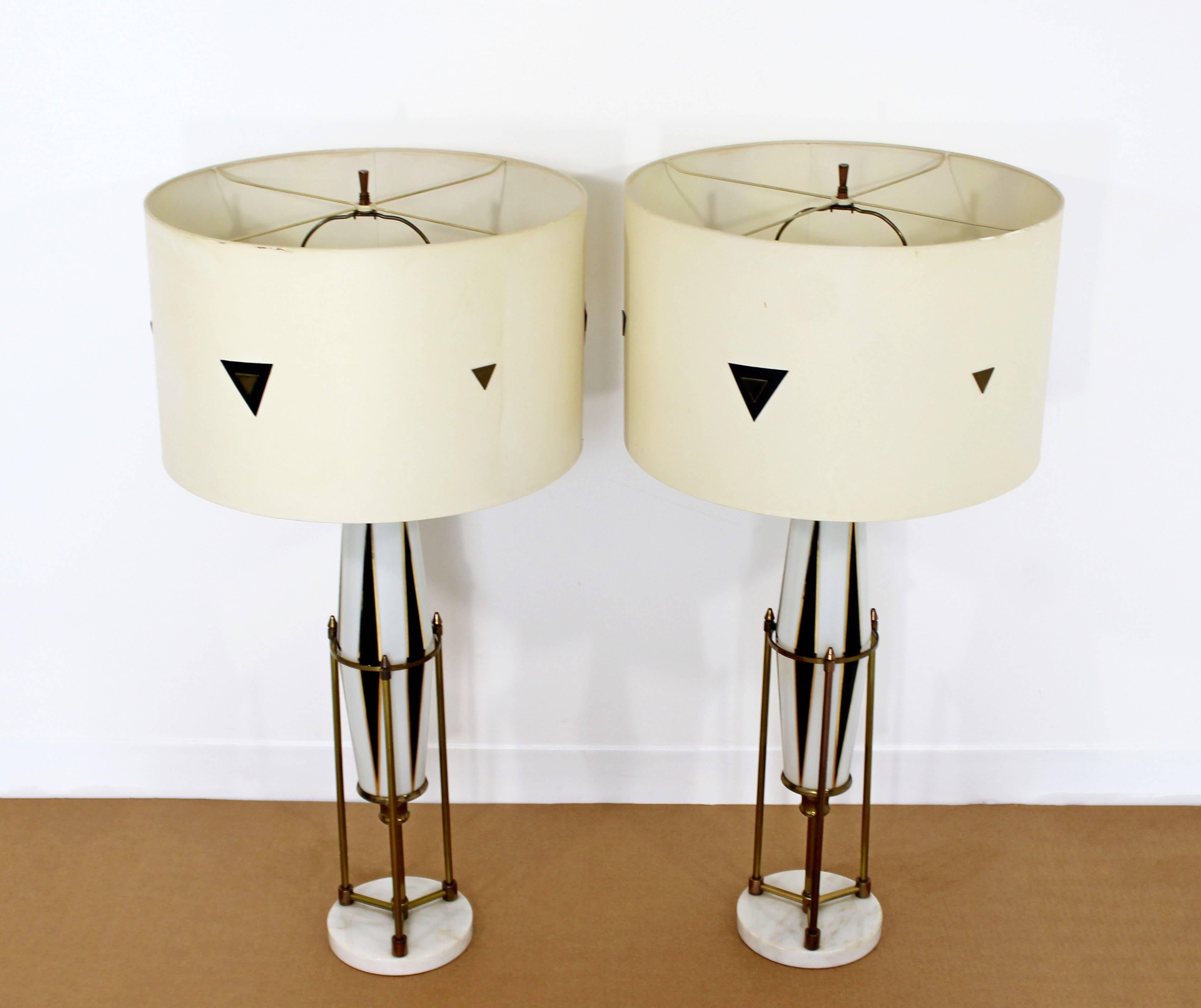 For your consideration is a pair of Hollywood Regency brass and glass table lamps on a marble base with original custom-made matching shades and brass finials, possibly by Lightolier. In excellent condition. The dimensions of the lamps are 7