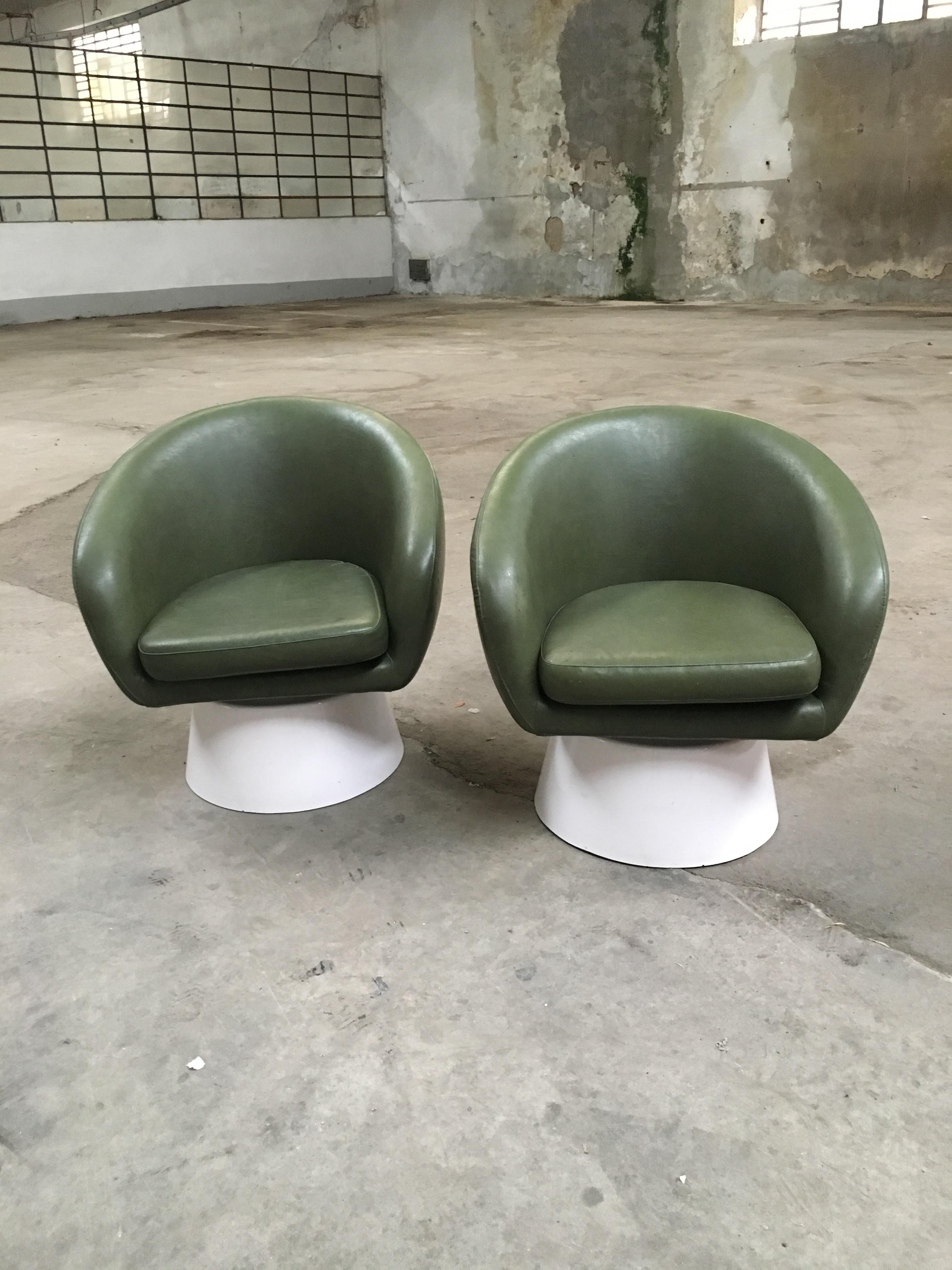 Mid-Century Modern pair of Italian faux leather armchairs with wooden white lacquered base from 1970s.