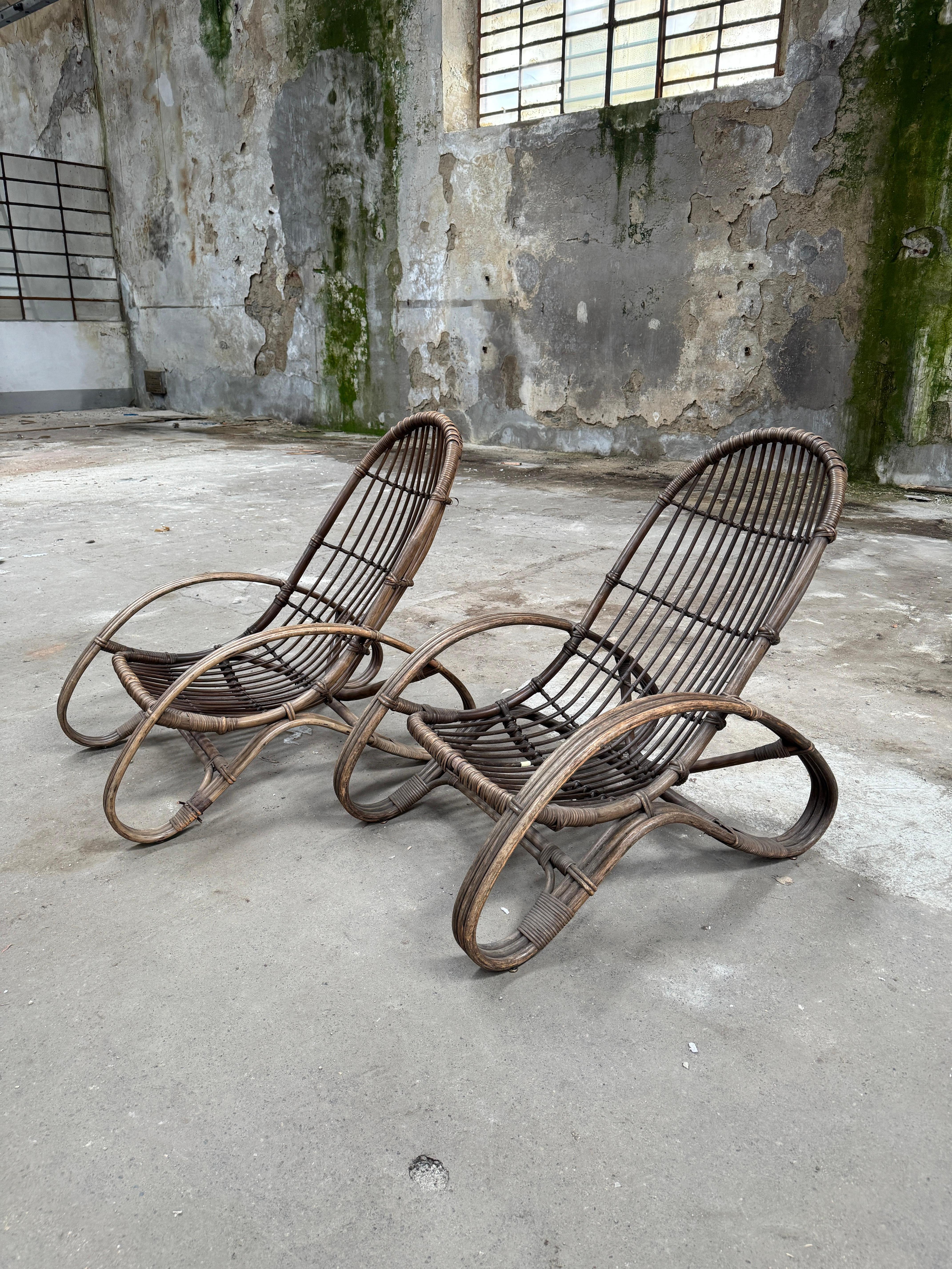 This exquisite pair of 1960s bamboo lounge chairs by Tito Agnoli is a true testament to timeless Italian design. With their sleek, organic lines and expertly crafted bamboo frames, they embody both elegance and comfort. What makes these chairs even