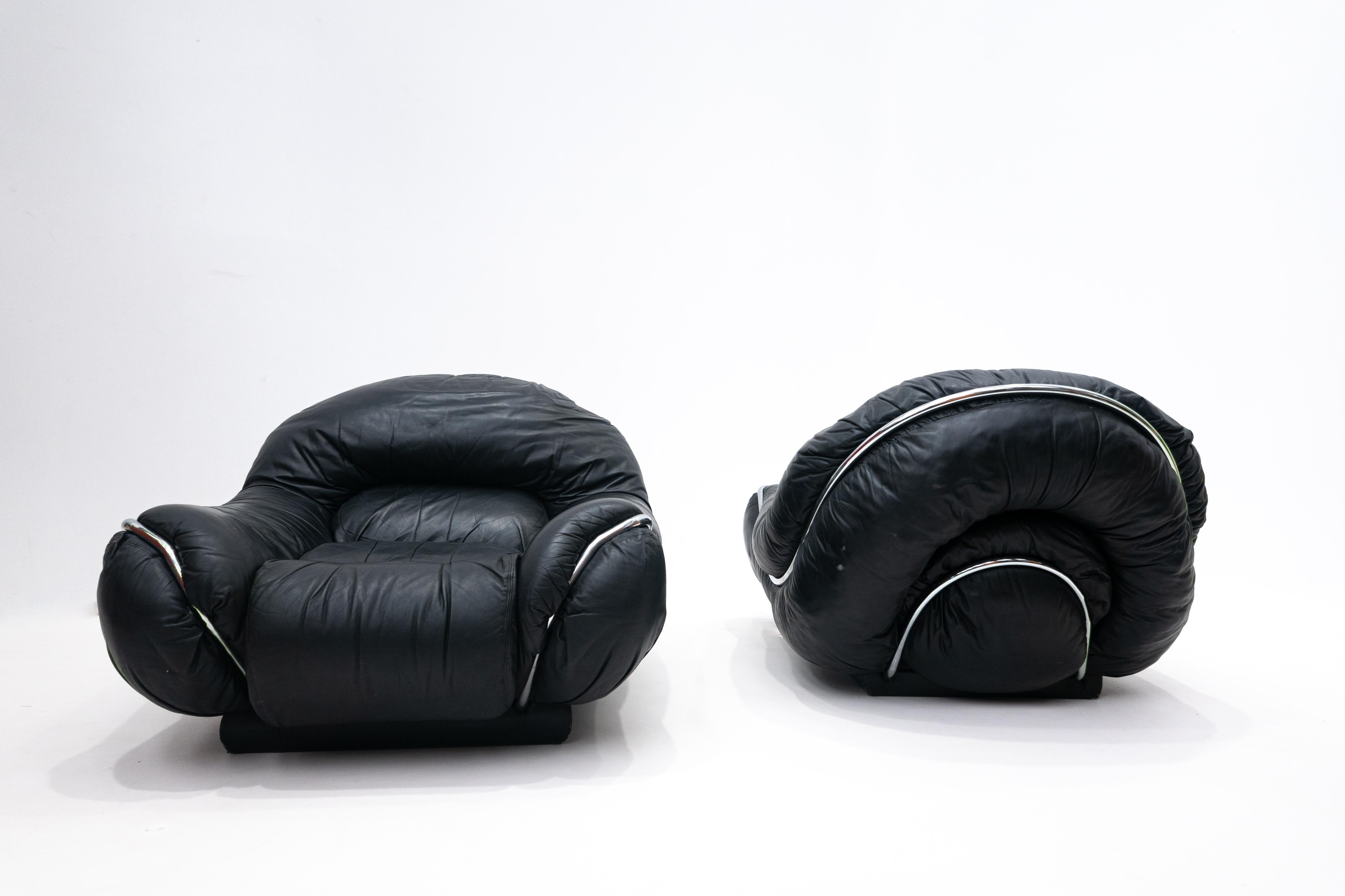 Mid-Century Modern pair of Italian black leather armchairs, 1960s.