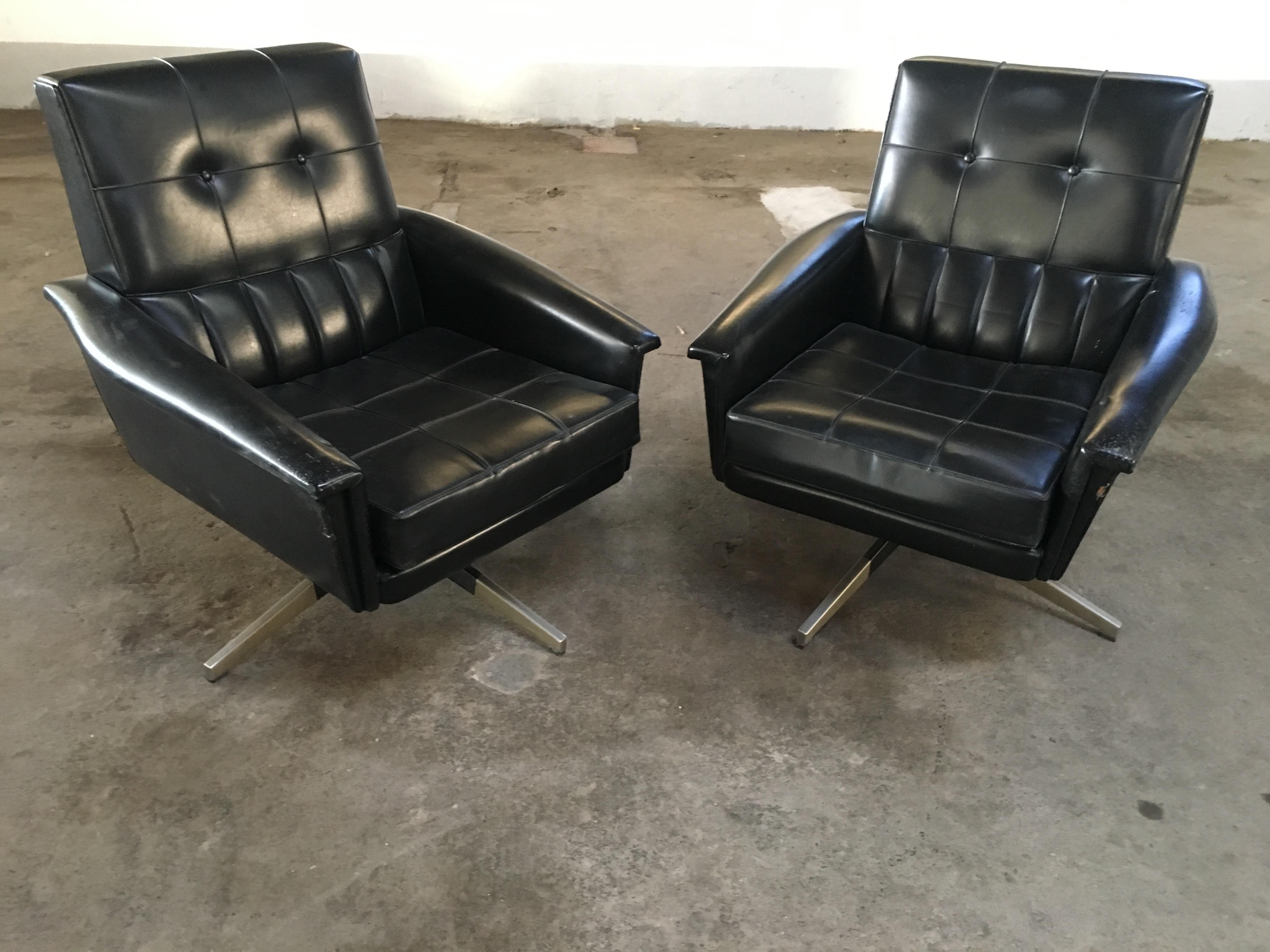 Mid-Century Modern pair of Italian revolving office armchairs in black faux leather with brass legs, 1960s
The armchairs show some wear due to age and use. They are in general good vintage conditions.
 