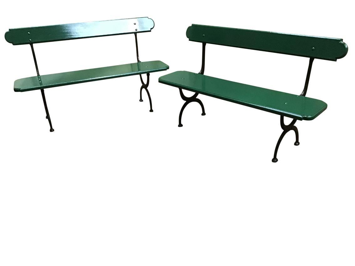 Mid-Century Modern pair of Italian green lacquered benches with cast iron structure, 1960s.