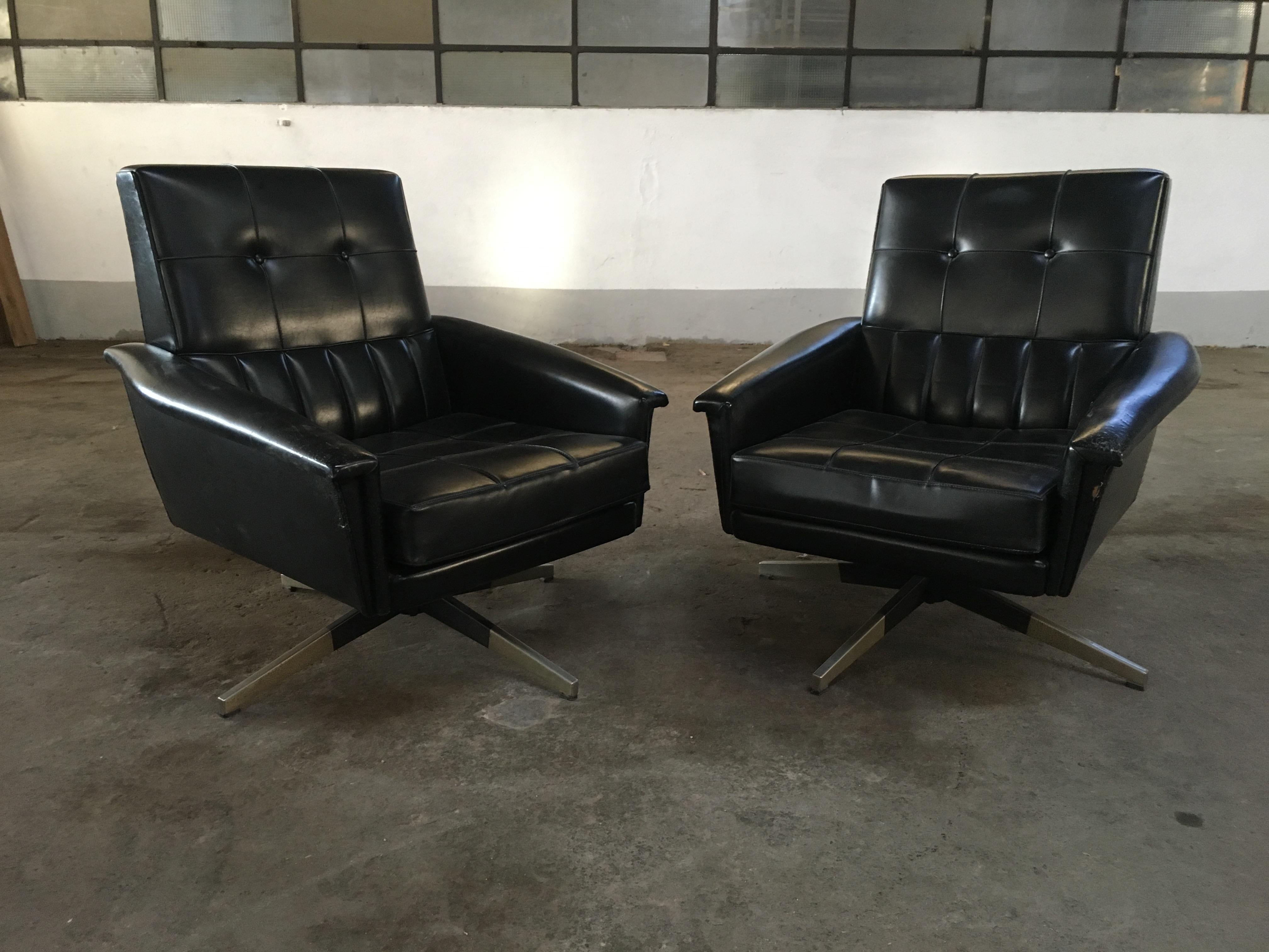 Mid-Century Modern pair of Italian revolving office armchairs in black faux leather with brass legs, 1960s.
The armchairs show some wear due to age and use. They are in general good vintage conditions.