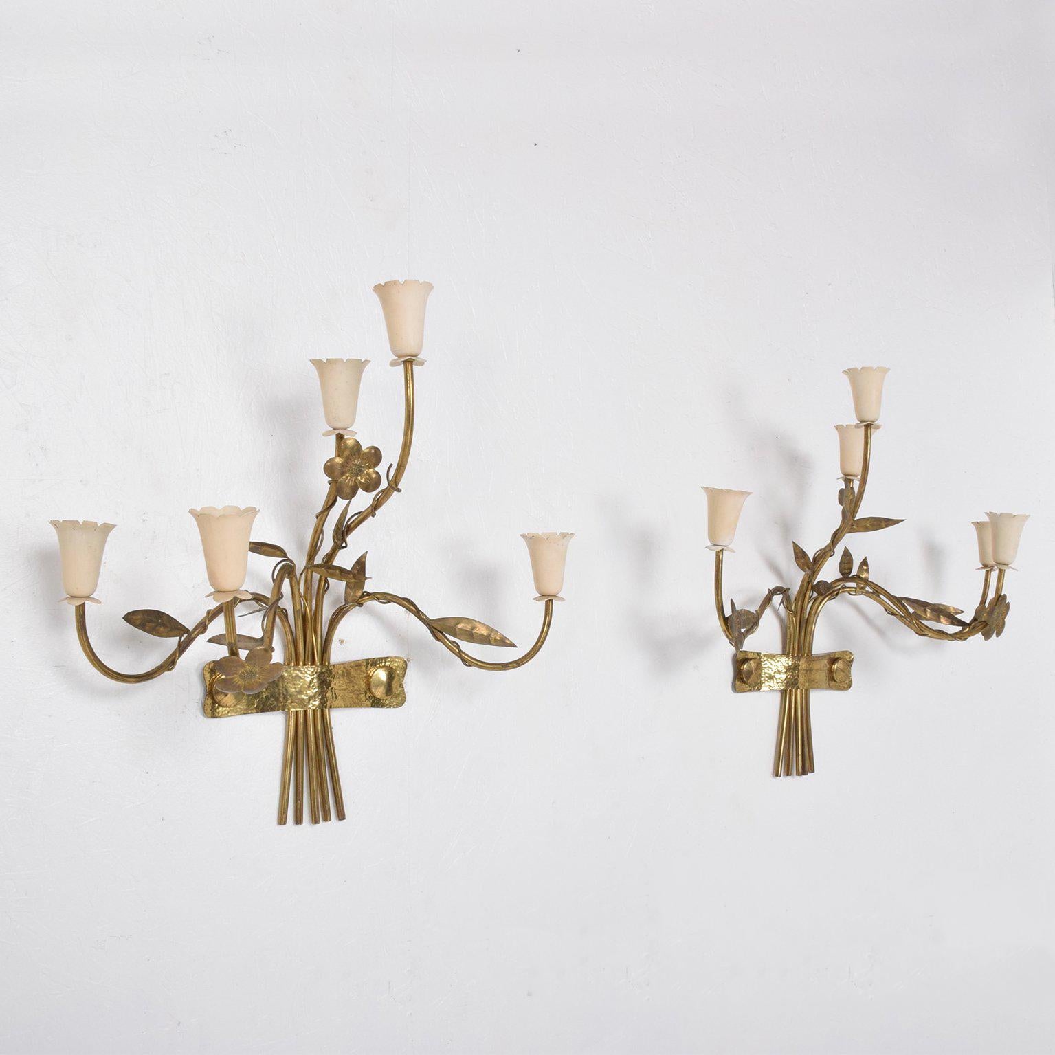 For your consideration a pair of Mid-Century Modern wall sconces. Made in Italy, circa 1950s.

Five arms with beautiful sculptural shape. 
Aluminium shade covers painted in original off-white color.

No stamp or label present from the maker.