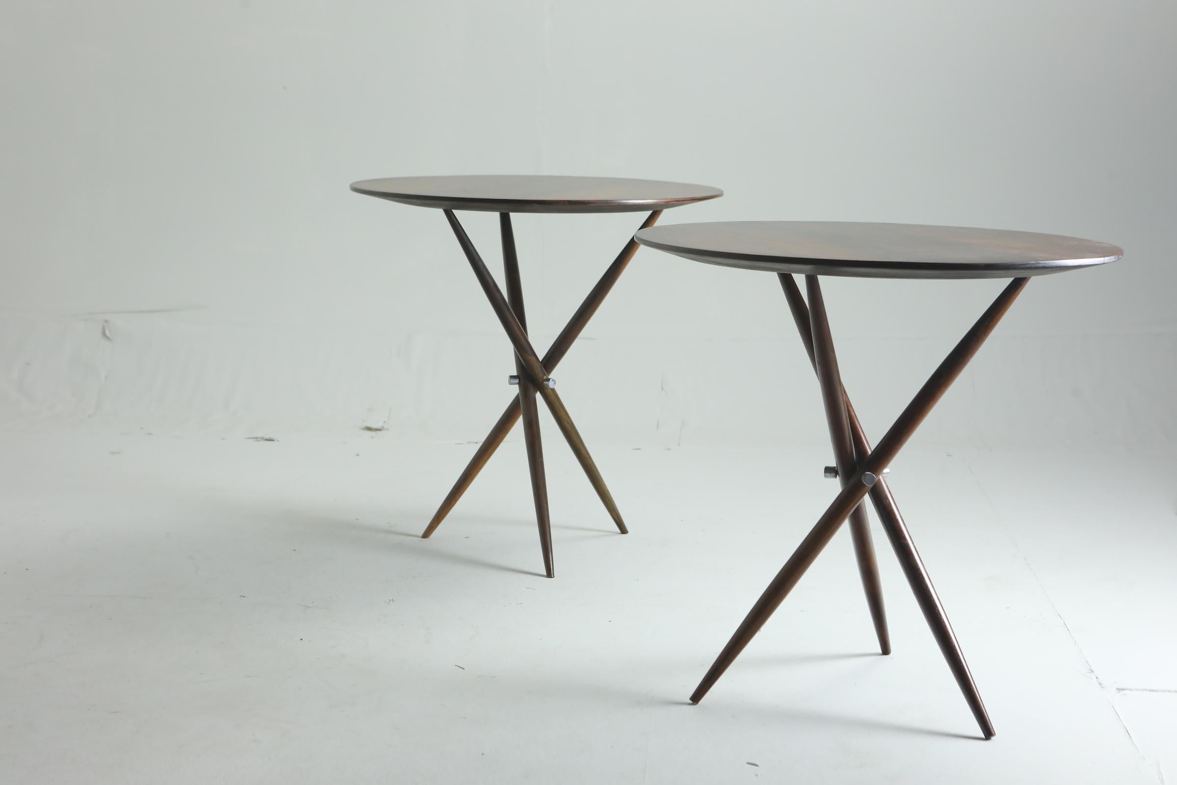 Mid-Century Modern pair of Janete round side tables by Sergio Rodrigues, Brazil 1950s

The elegant Janete side table is a 1950s creation by the acclaimed Brazilian architect and designer Sergio Rodrigues. Structured in wood, this table features a