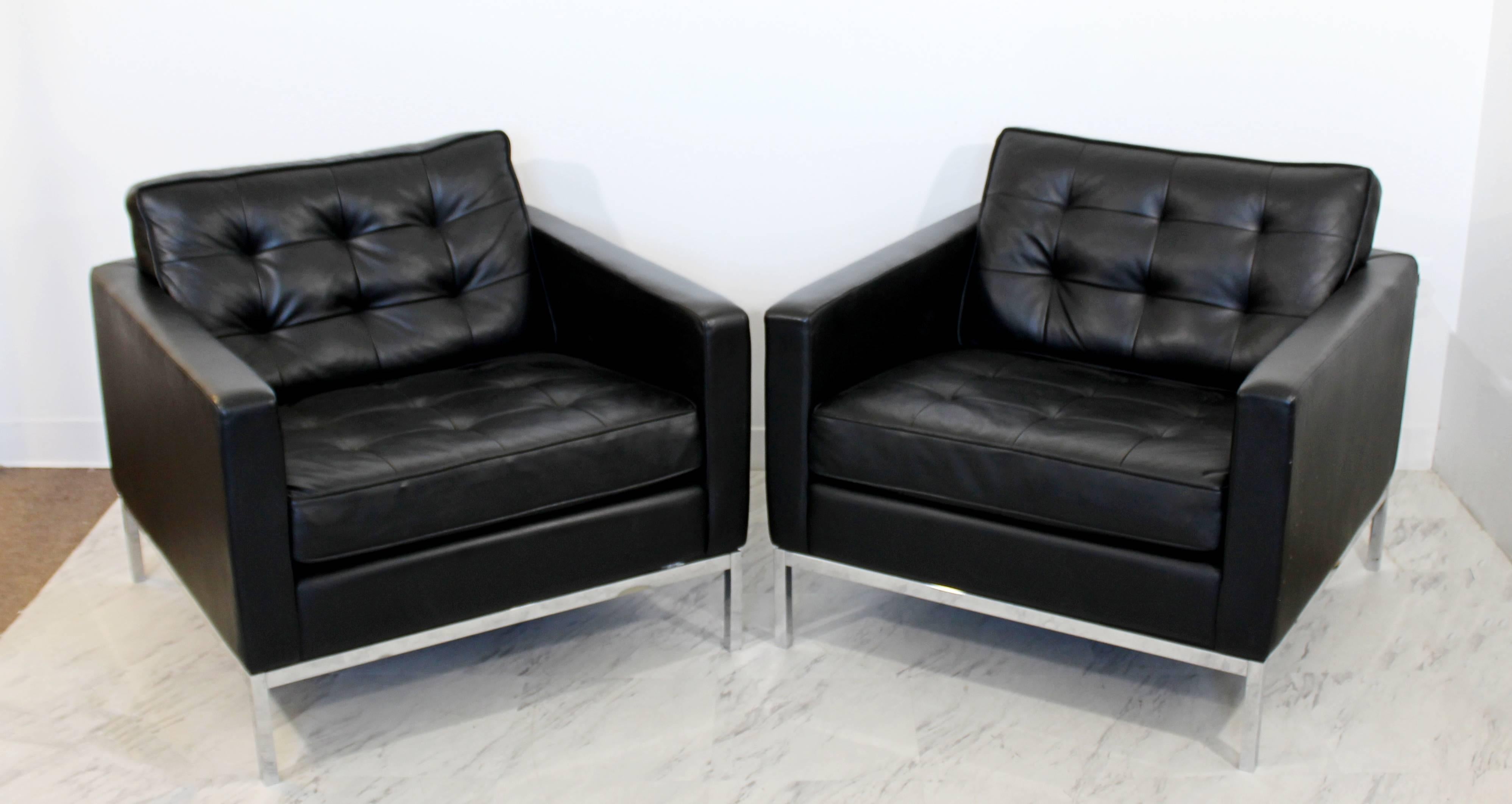 For your consideration is a beautiful pair of chrome cube lounge chairs, with tufted black leather upholstery by Knoll. In excellent condition. The dimensions are 32.5
