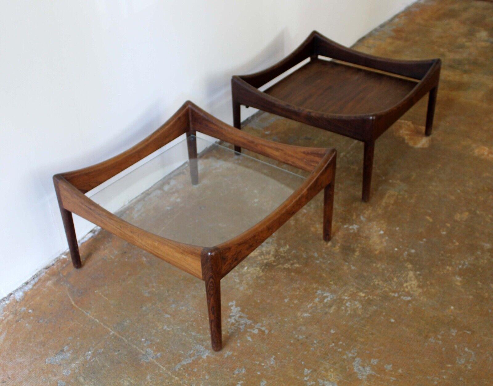 We present a pair of stunning rosewood end side tables by Danish designer Kristian Vedel. What makes them especially interesting is that one has a floating glass top and the other has a floating rosewood top. In excellent condition. Dimensions: 22