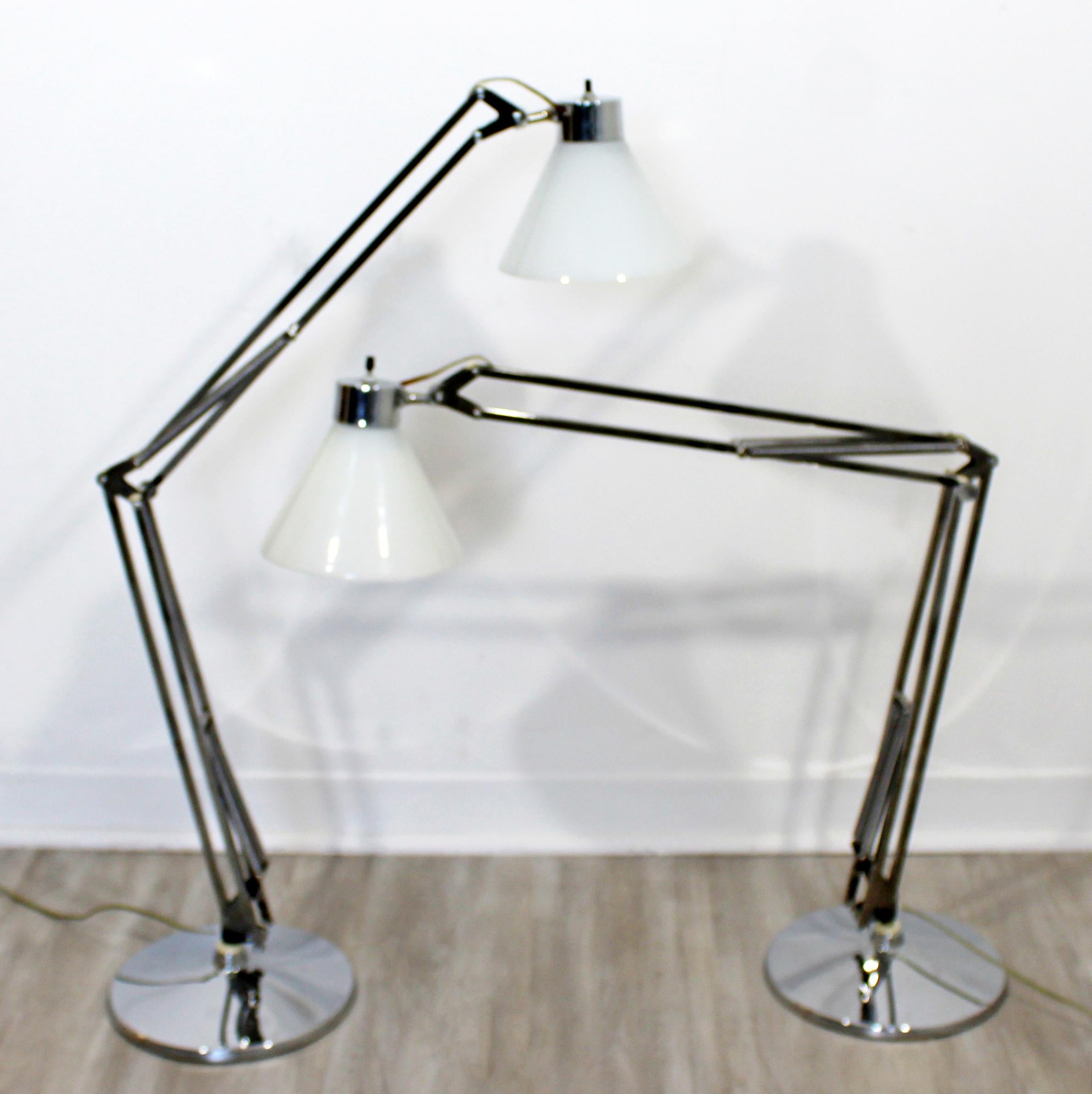 For your consideration is a stupendous pair of adjustable, chrome table lamps, with glass shades, by Luxo, circa 1960s. In excellent vintage condition. The base measures 9.5