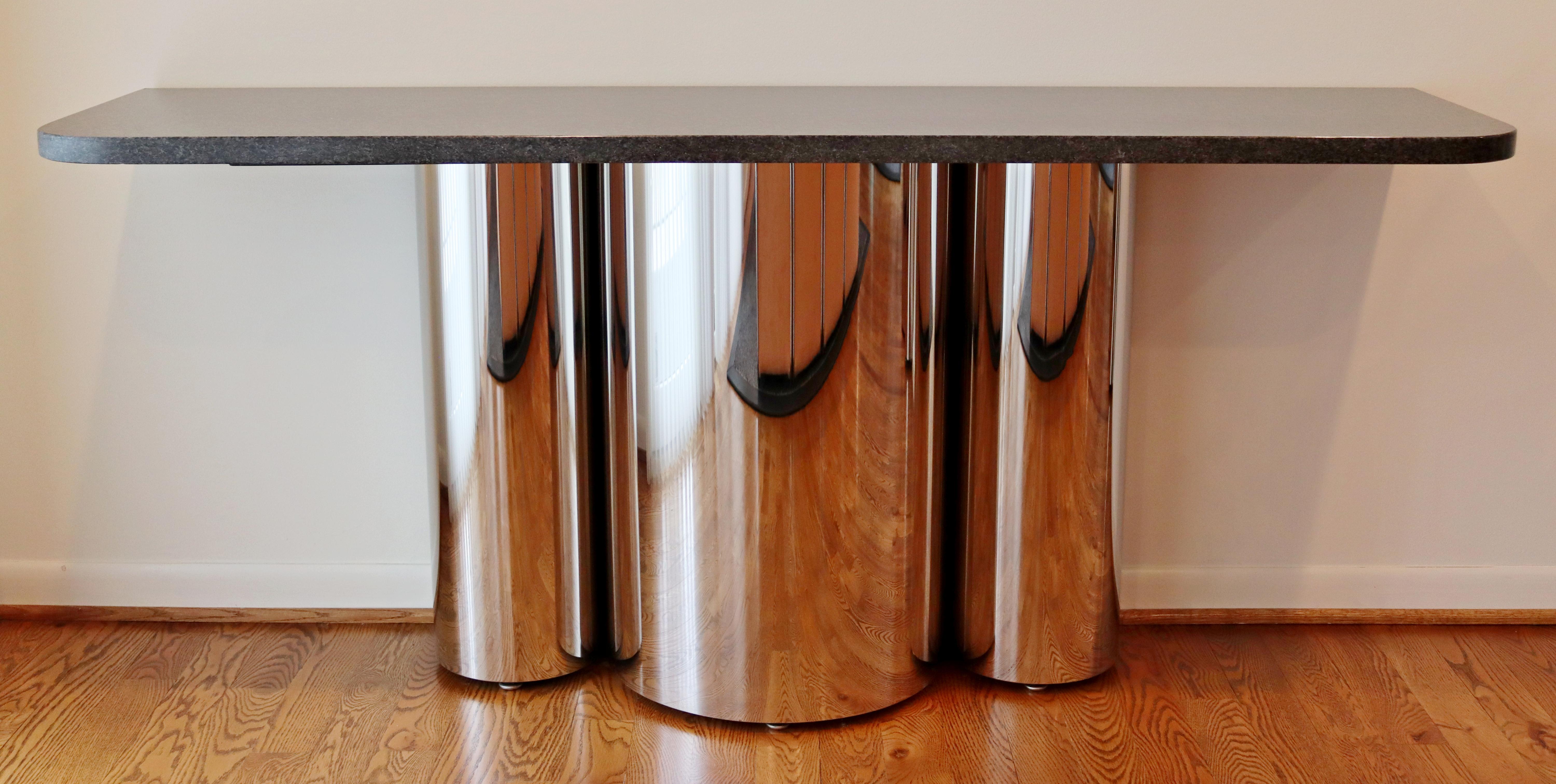 For your consideration is a magnificent pair of console tables, made of chrome and with marble tops, circa the 1970s. In excellent vintage condition. The dimensions are 66