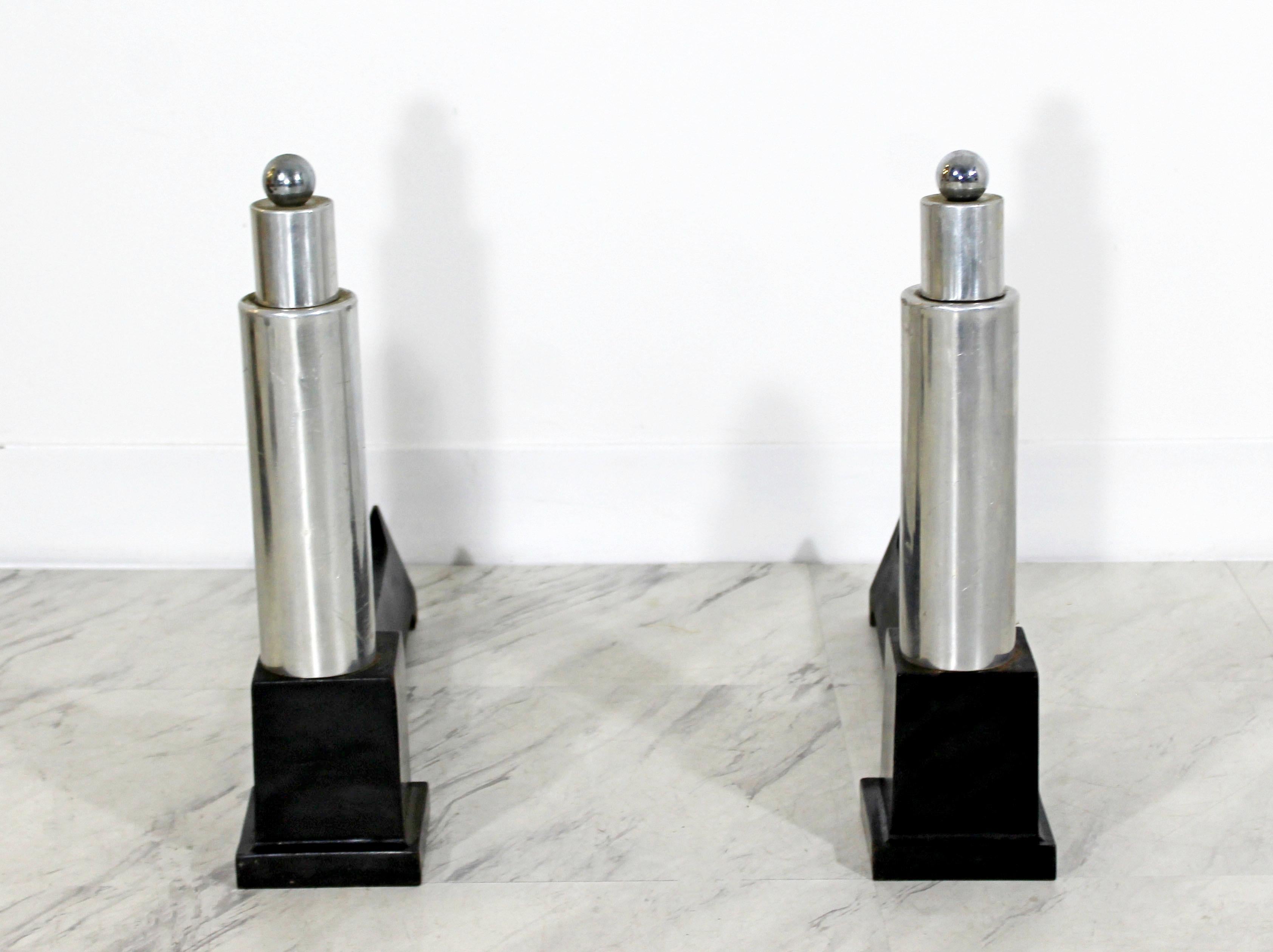 For your consideration is a wonderful pair of aluminum and iron andirons by Cutter. In excellent condition. The dimensions of each are 4