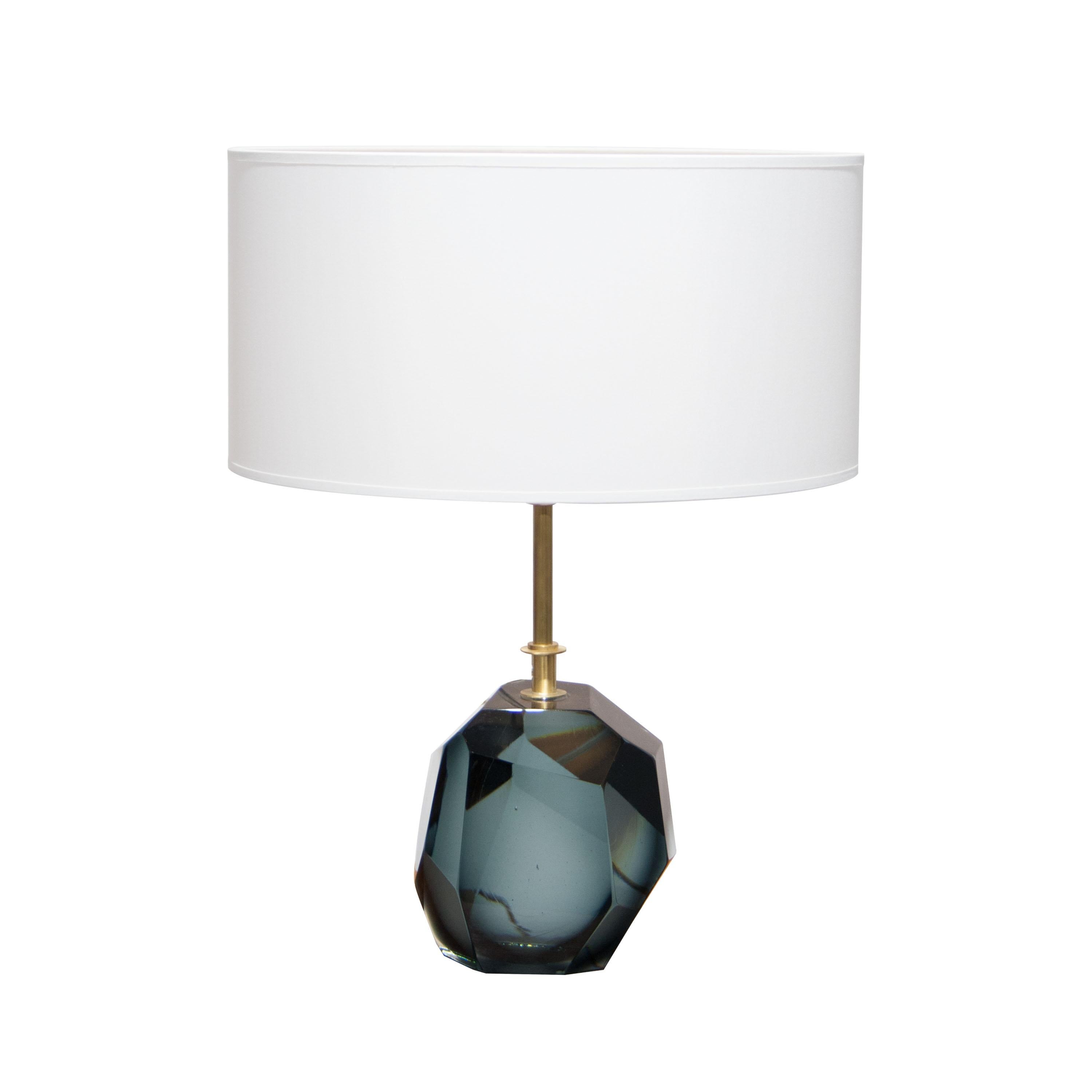 Pair of table lamps with Murano faceted glass in translucent grey and brass stem made by hand.