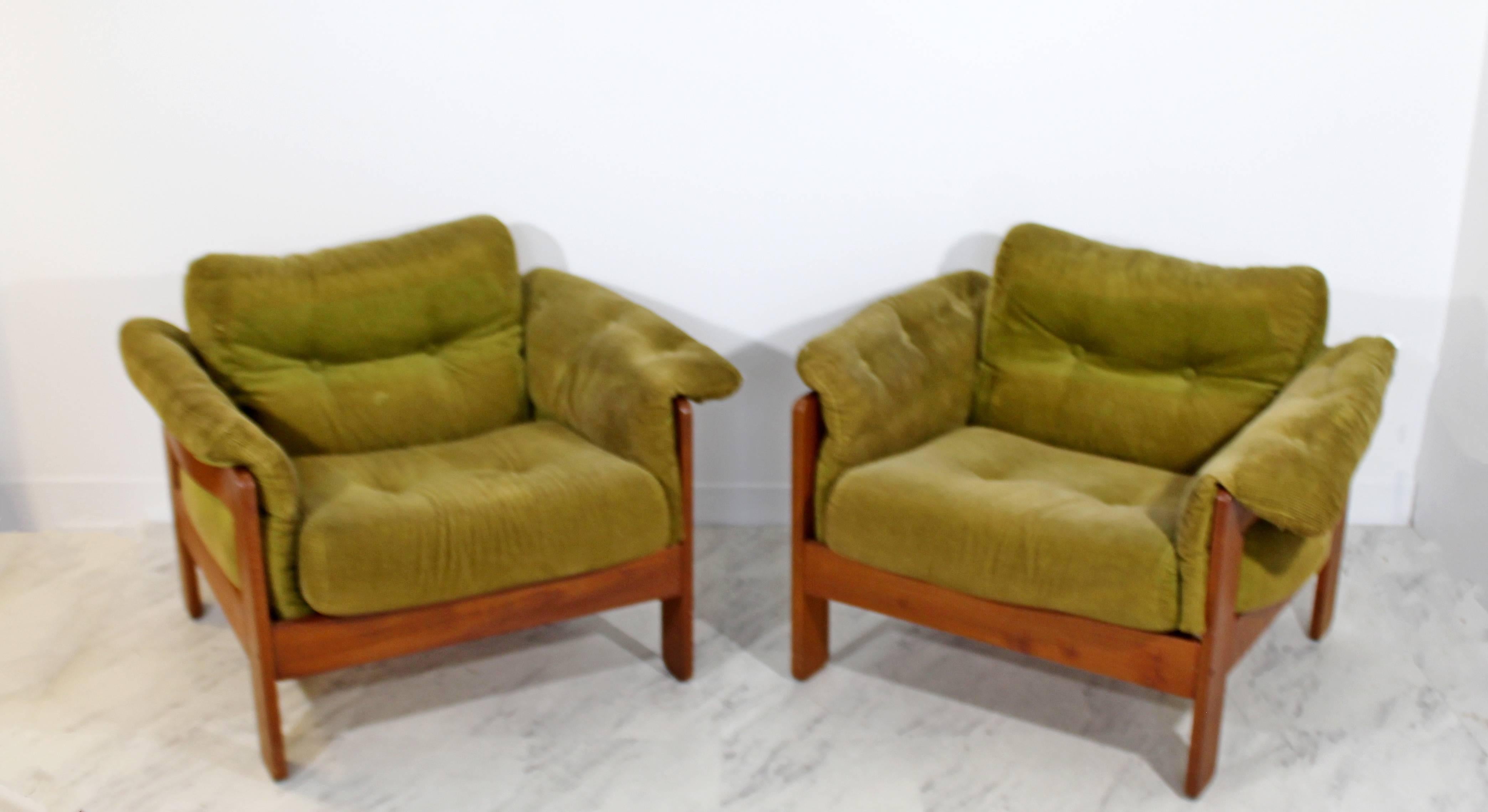 For your consideration is a pair of lounge chairs, on stunning wooden bases, with cushions that snap onto the chair by N. Eilersen control, Denmark, circa 1960s. Bases are in excellent condition, but the cushions need to be reupholstered. The