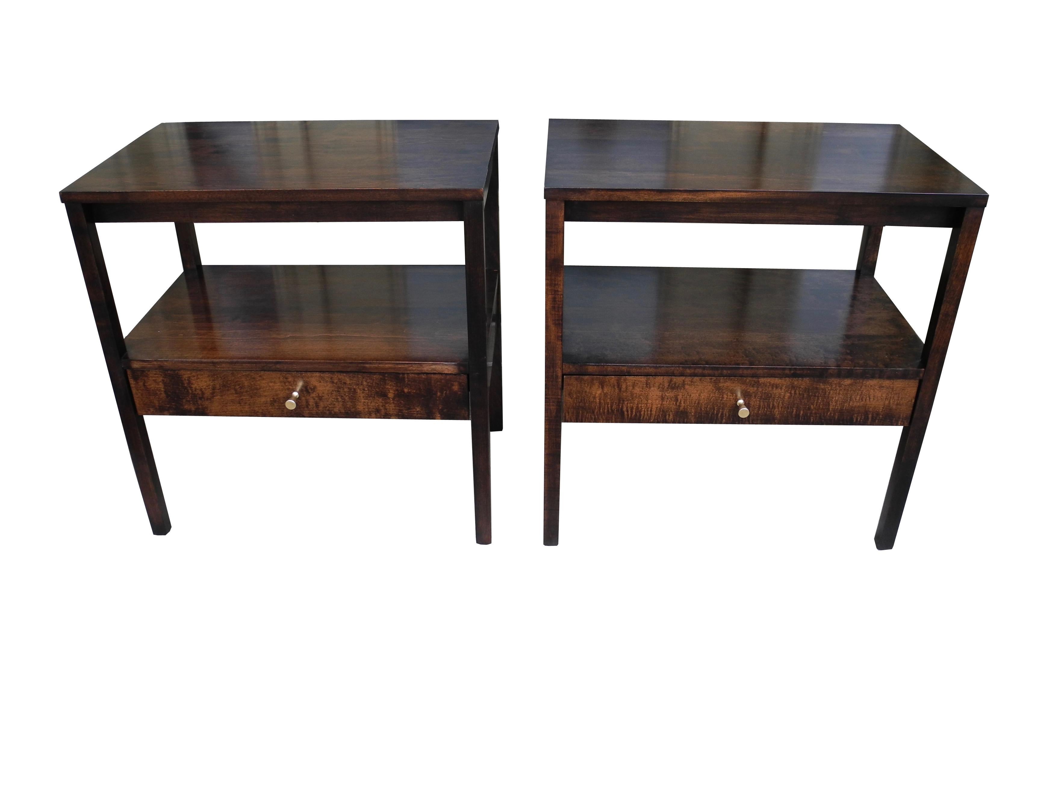 These modern nightstands / bedside tables were designed by Paul McCobb. Each is equipped with a single drawer and shelf.
The knobs are solid brass. Sold as a pair.
 