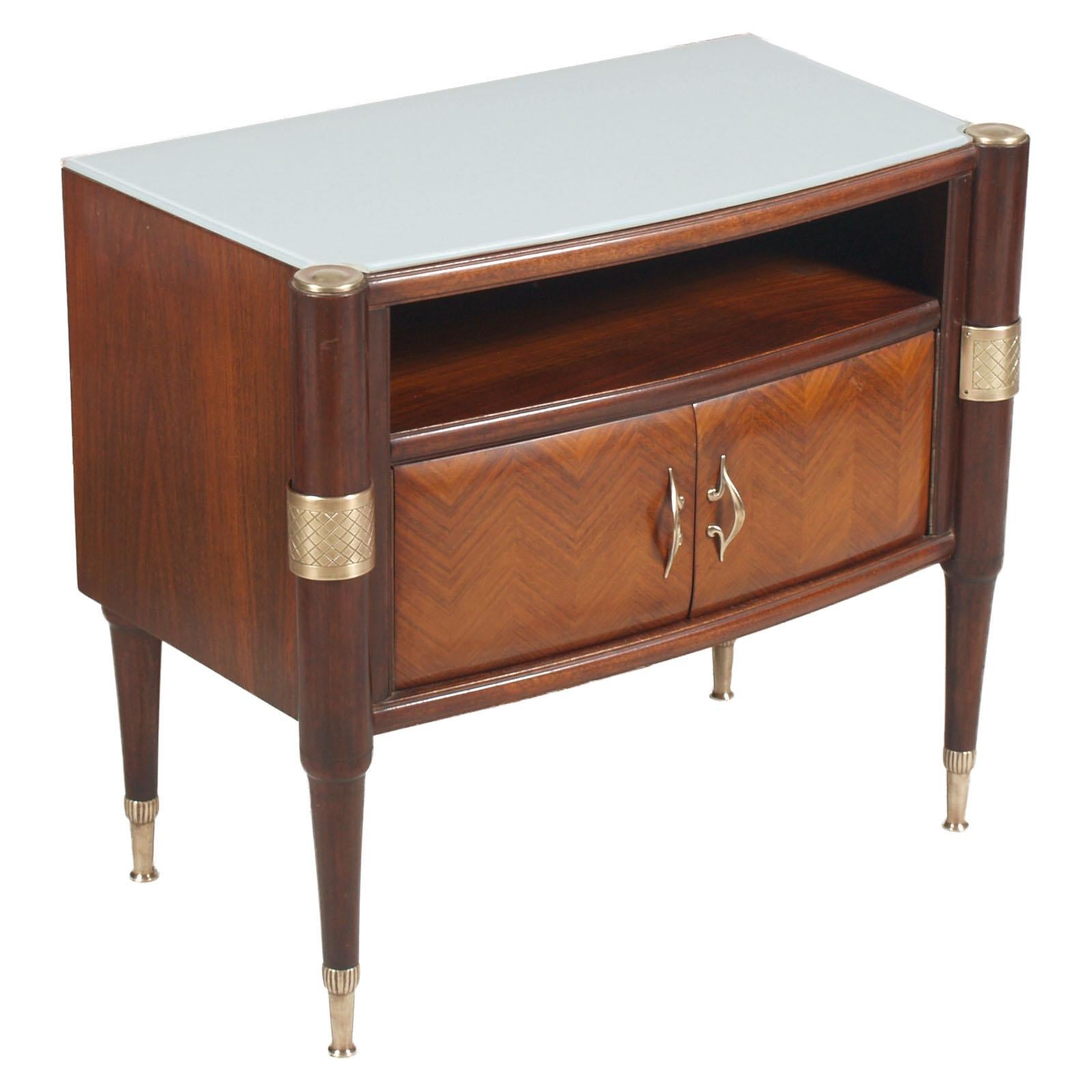 Elegant 1950s Italy Mid-Century Modern pair of nightstands, La Permanente Mobili Cantù, by Pier Luigi Colli . All in wood of mahogany, solid and veneered, with golden brass fittings; top in lacquered glass. Wax polished. 
On request we can sell the