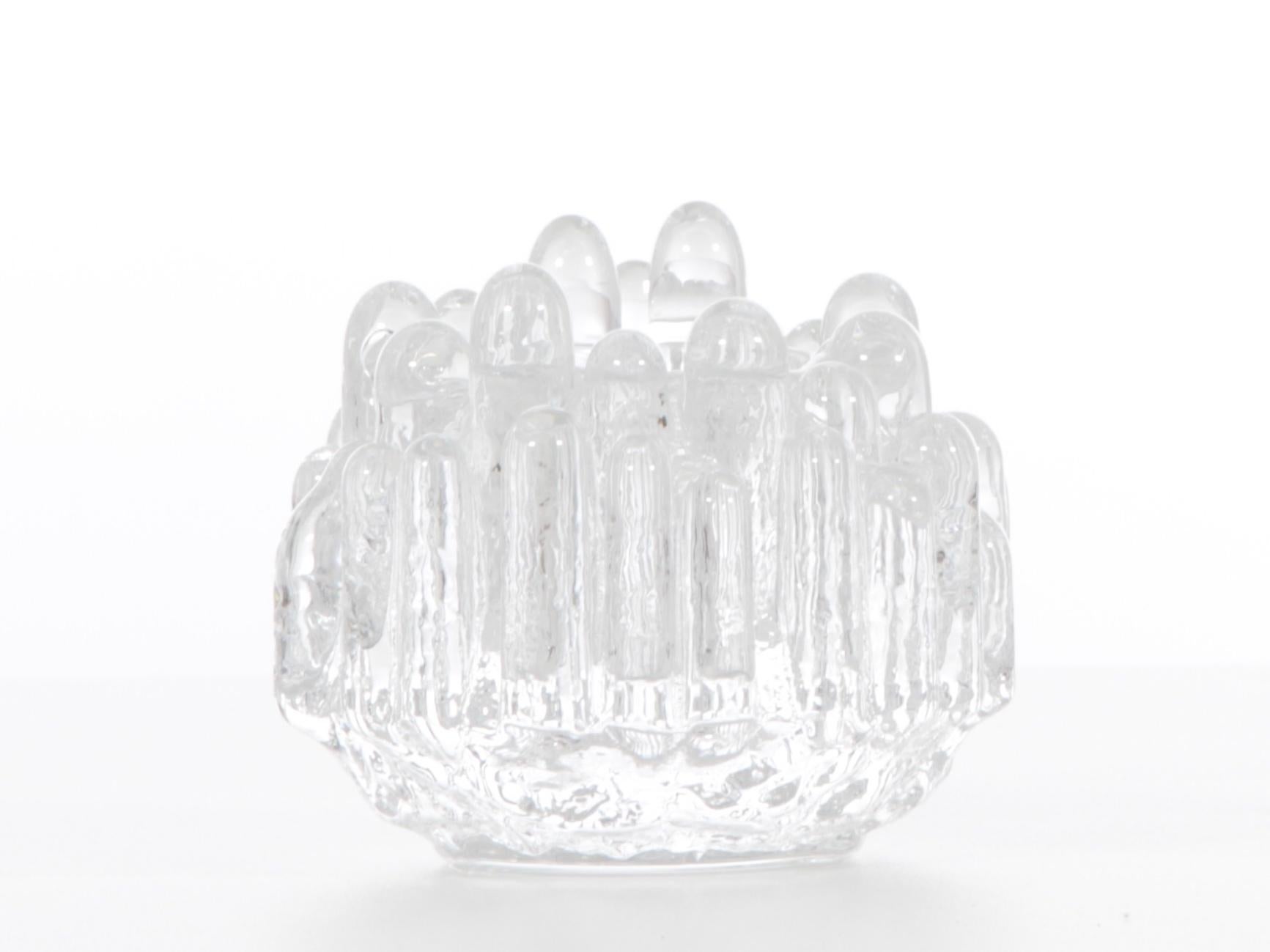 Pair of crystal polar candlesticks by Goran Warff for Costa Boda.

Polar candleholders are a Swedish classic.
When Goran Warff created the Polar collection in the late 1960s at Kosta Boda, he gave his candlesticks a form of ice block playing on