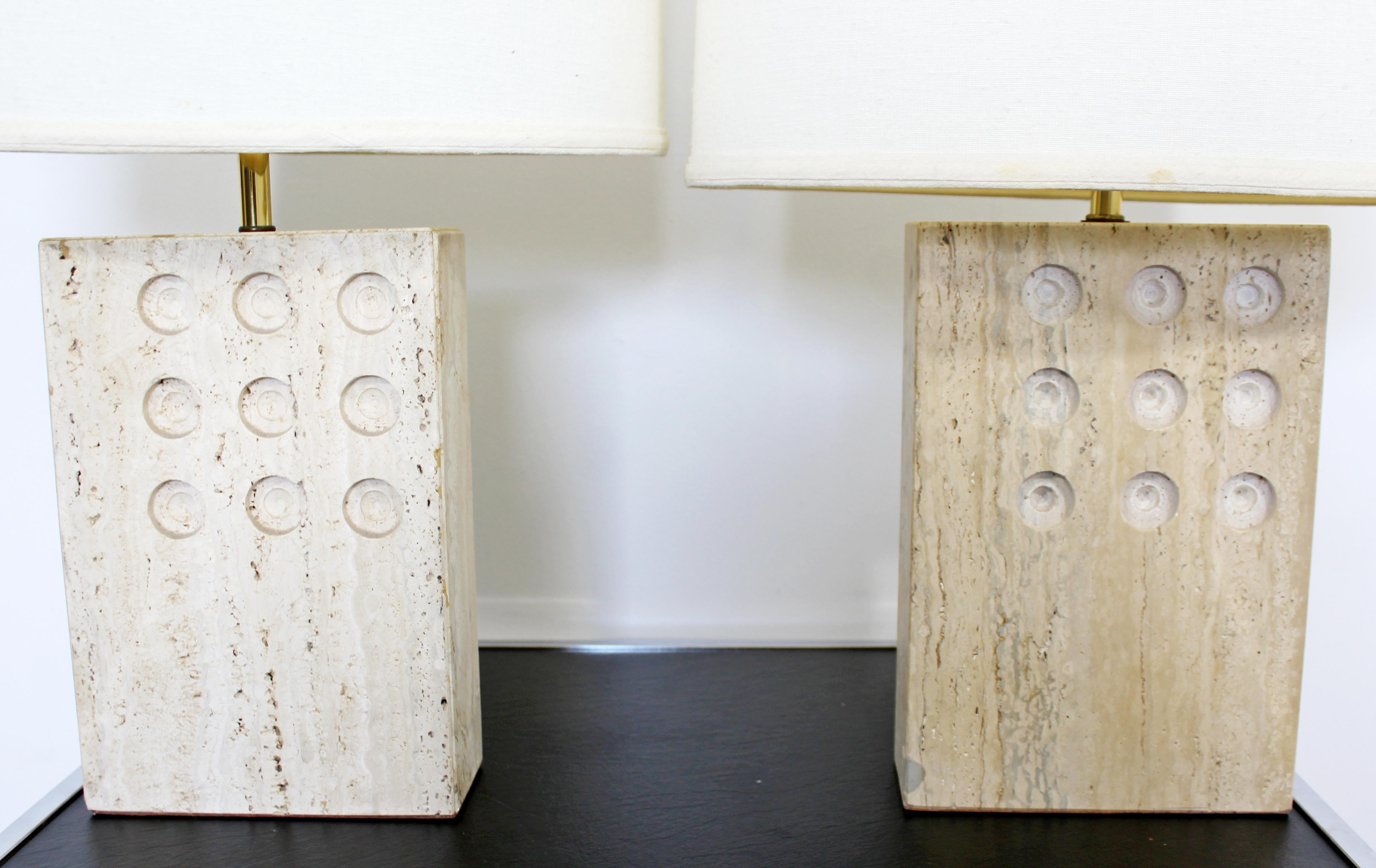 For your consideration is a gorgeous pair of travertine stone table lamps, with their original shades and finials, by Goffredo Reggiani for Raymor, circa 1960s. In excellent vintage condition. The dimensions of the lamps are 8