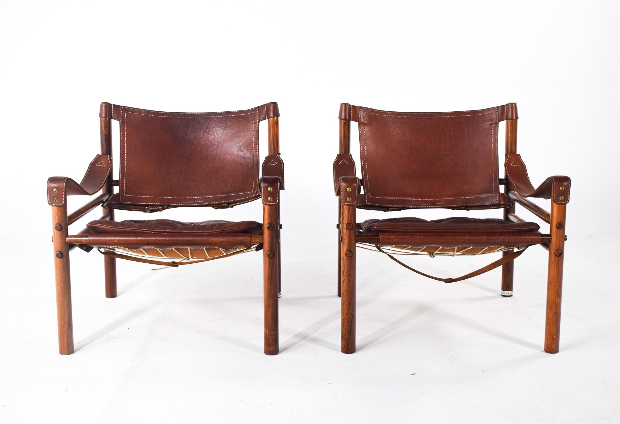 Mid Century Rosewood pair of armchairs by Arne Norell, produced in the 1960´s of Sweden provenance. 
Exquisite materials, rosewood with beautiful veneer and leather in excellent vintage conditions. High quality design and materials. 
 