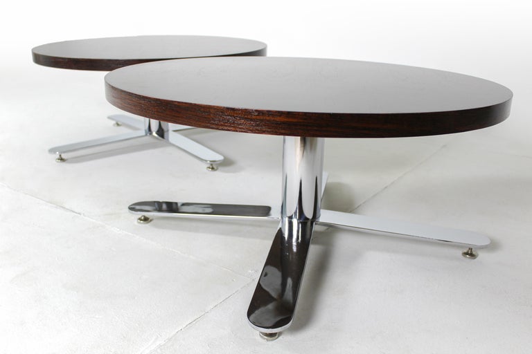 Mid-Century Modern pair of wood coffee tables, Brazil, 1960s.

This elegant modernist pair of coffee tables was manufactured in the 1960s by the Brazilian manufacture Mobília Contemporânea, featuring a chromed metal iron base and a beautifully