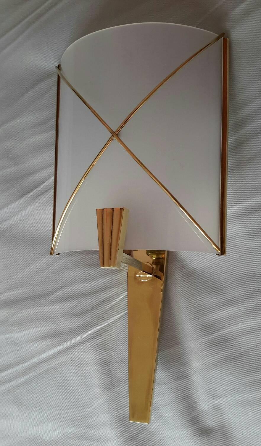 Beautiful and rare pair of French sconces mid-1950s in brass and perspex by Lunel.

The pair is in original condition (almost new), the sconces have been rewired and fit the US standards. (Bayonet socket 40 watts max.)
A documentation is provided