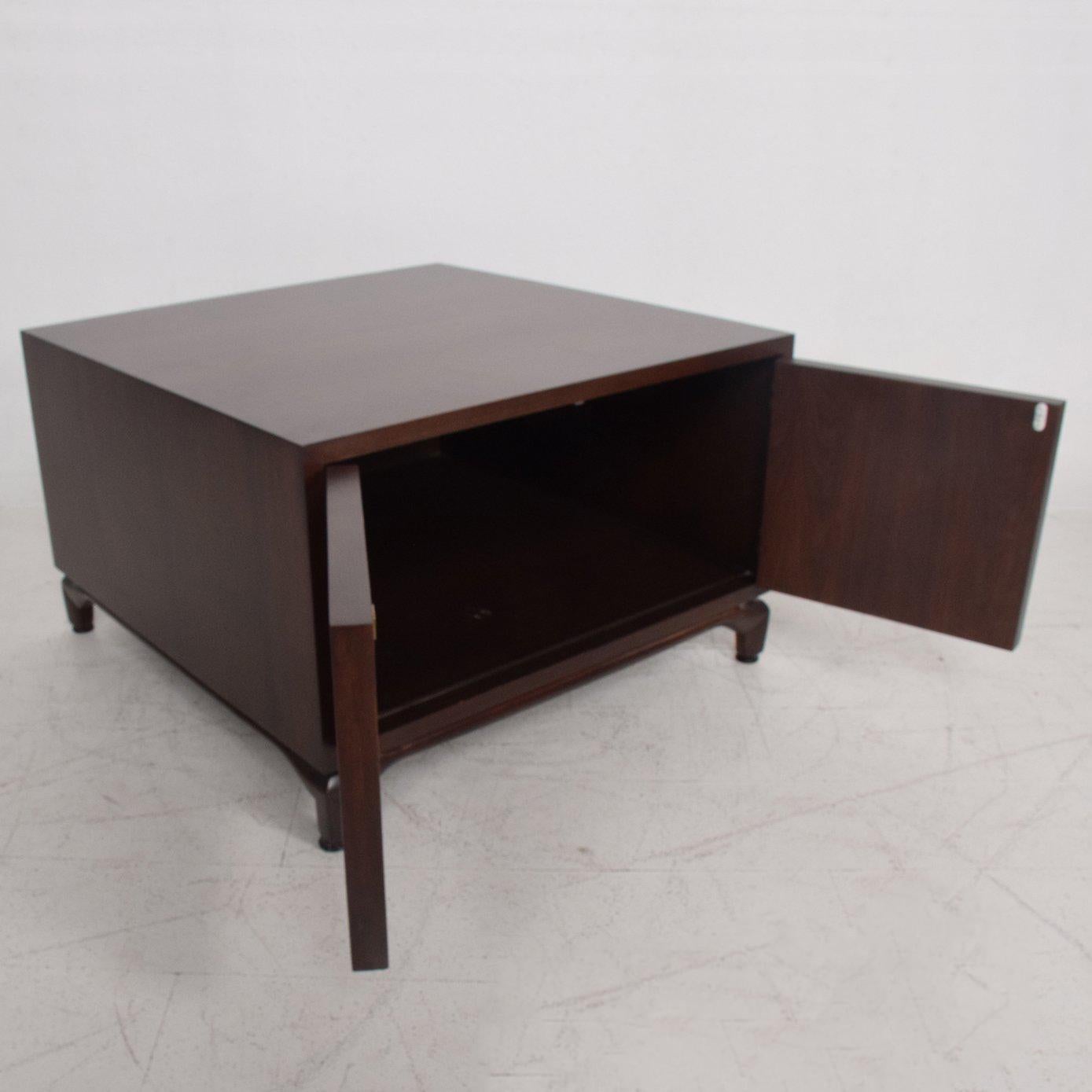 For your consideration a pair of side tables or cabinets with two doors (push on magnetic lock system) with decorative ornamentation on front doors. 

Beautiful sculptural solid walnut wood base. 

USA circa 1960s. Unmarked. Attributed to Cal