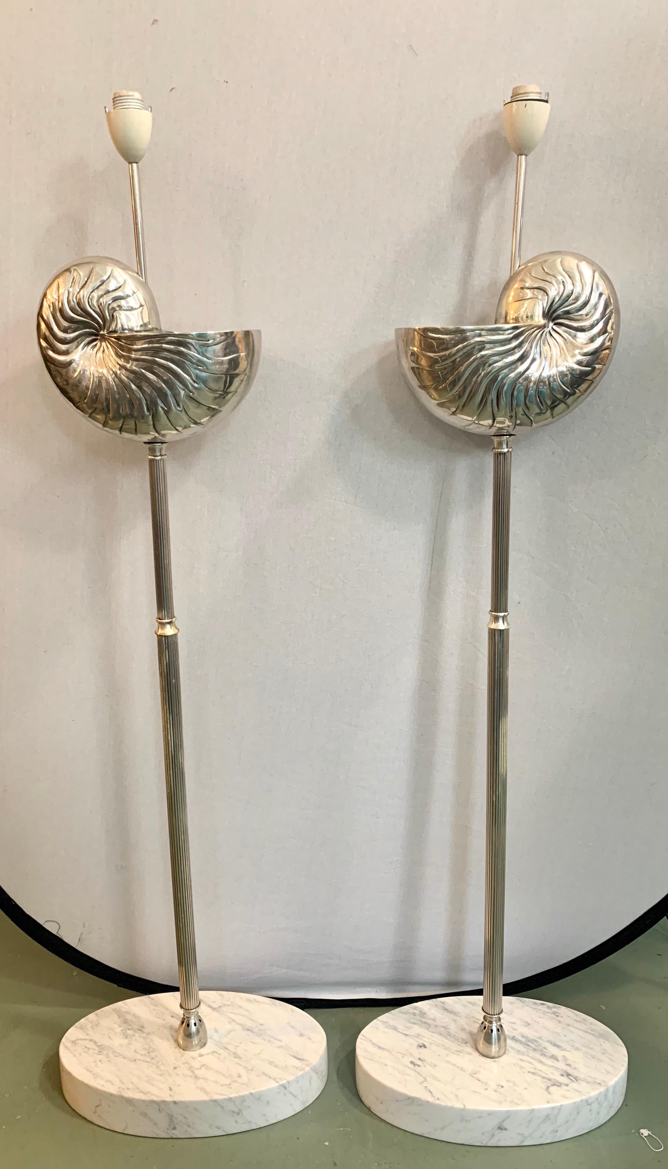 Unusual pair of matching tall Mid-Century Modern snail shell silver floor lamps with one bulb.
Wired for USA and in perfect working order. Now, more than ever, home is where
the heart is.