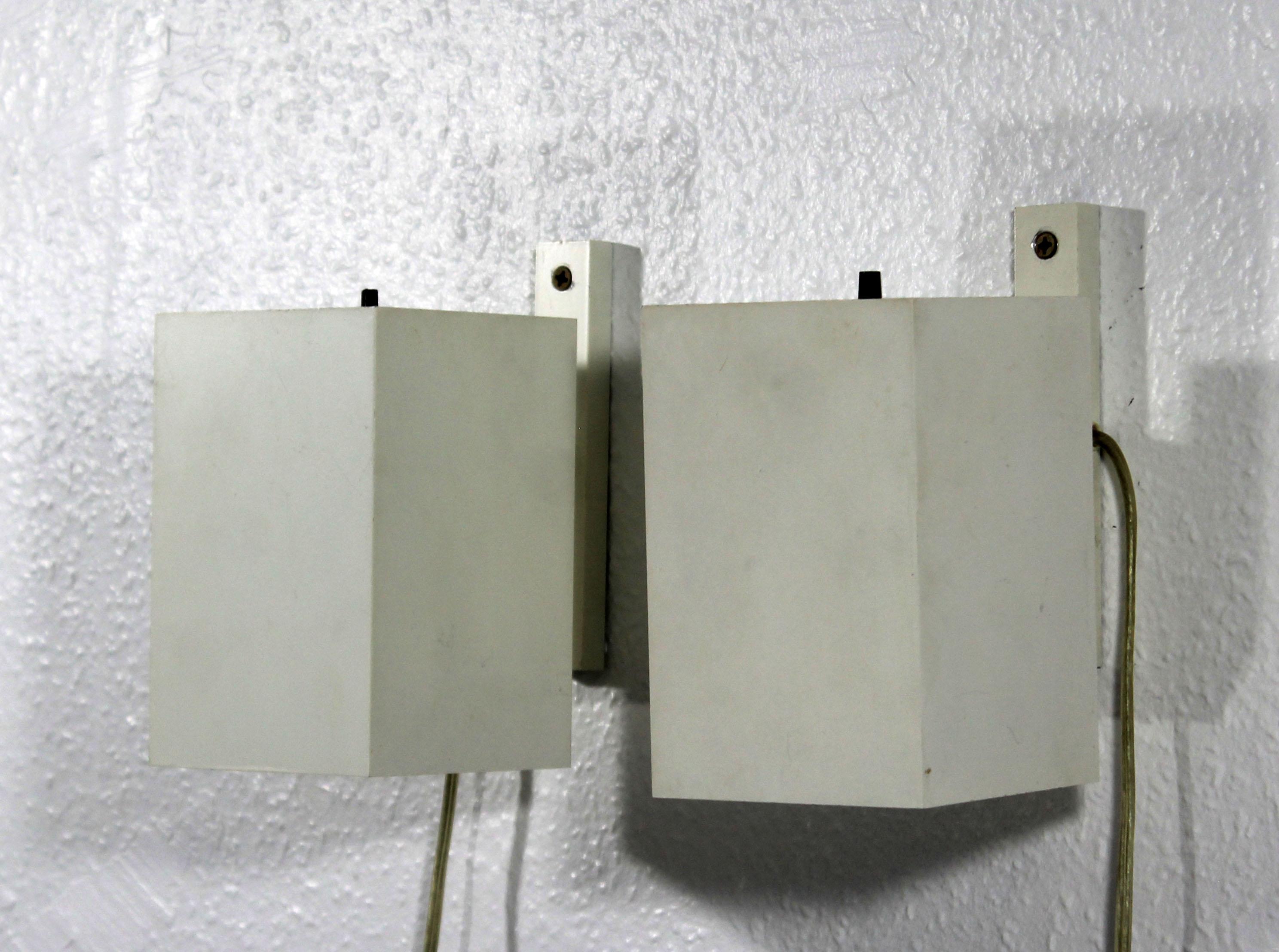 For your consideration is a sweet, little pair of metal wall sconces, circa the 1960s. In very good condition. The dimensions of each are 4