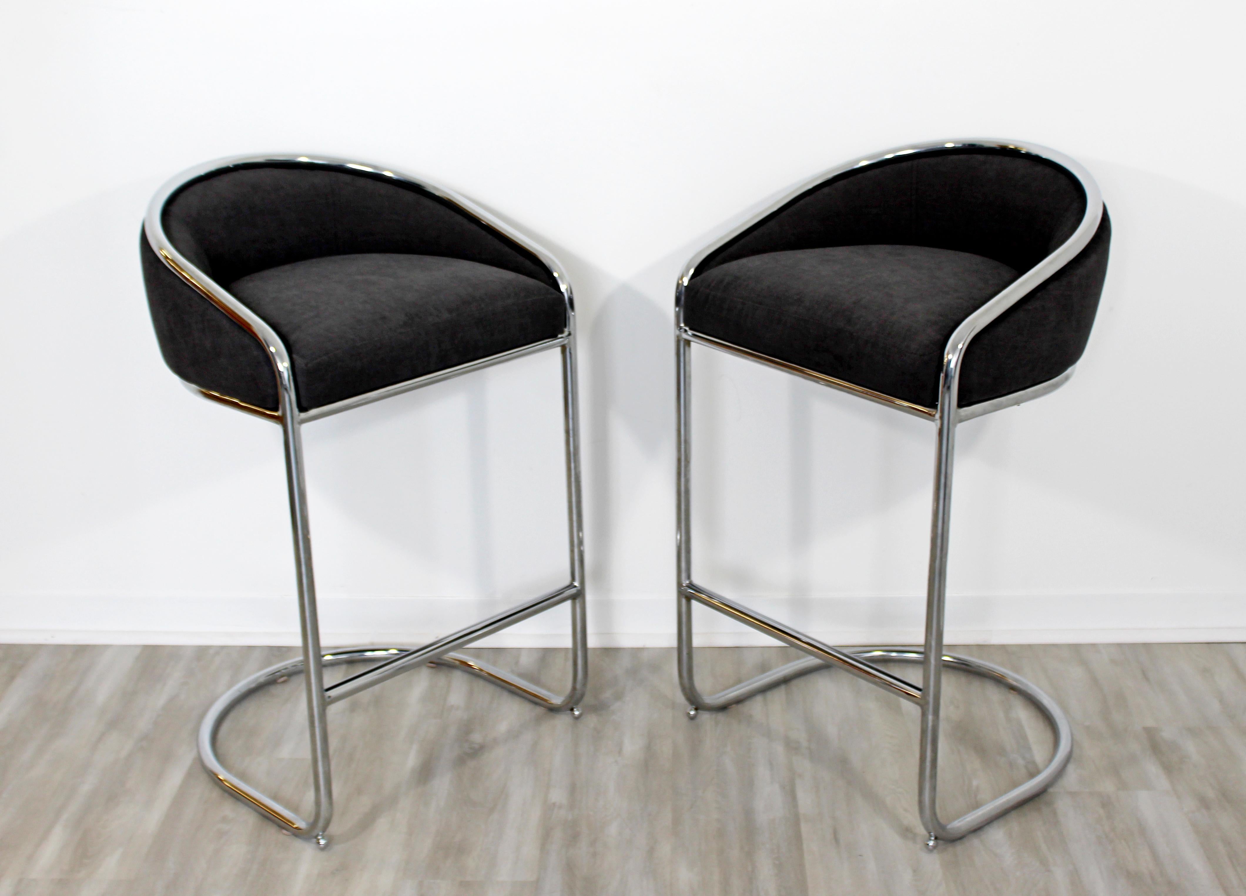 For your consideration is a fantastic pair of tall, chrome bar stools, with plush seats, in the style of Thonet, by Contemporary Shells Inc, circa the 1970s. Newly reupholstered and in excellent condition. The dimensions are 22