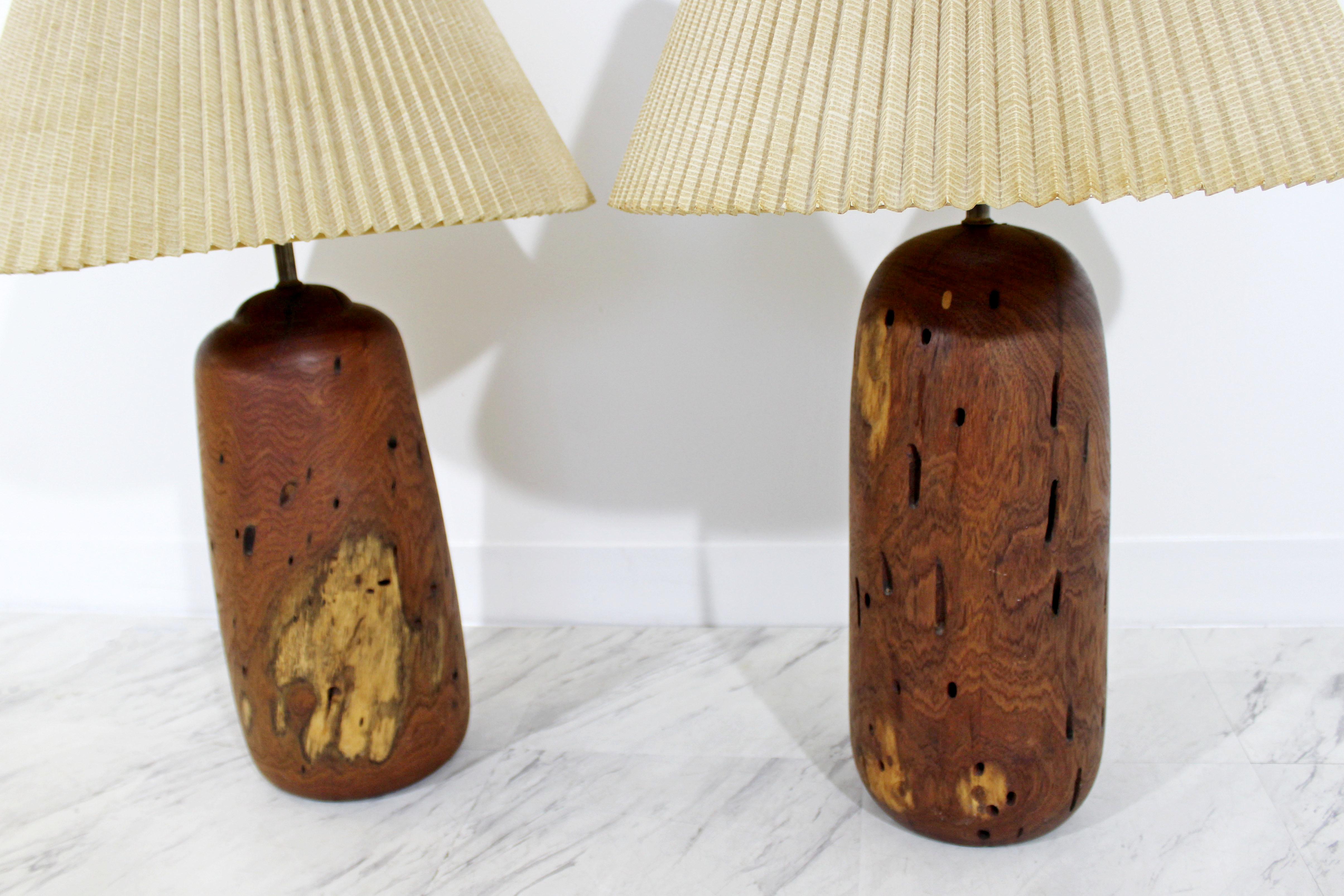 For your consideration is a wonderful and heavy pair of turned wood table lamps, with original shades and brass ring finials. Pair have actual dimmers. In excellent condition. The dimensions of each lamp are 7