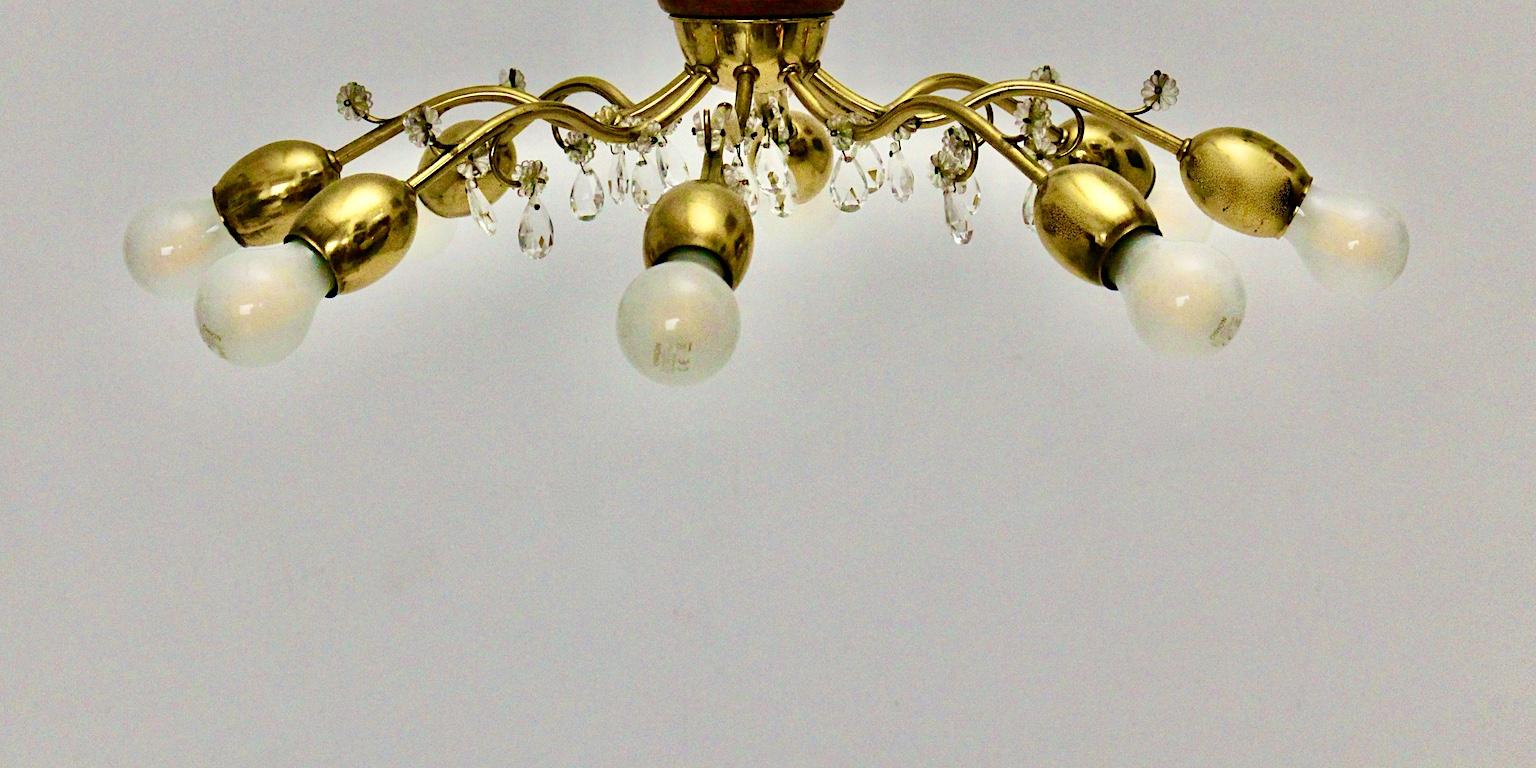 Mid-Century Modern pair of vintage chandeliers or pendants or flushmounts, which are designed and executed by J. & L. Lobmeyr 1950s in Vienna.
Delicate Mid-Century Modern sunburst flush mounts characterized through its brass, which may show