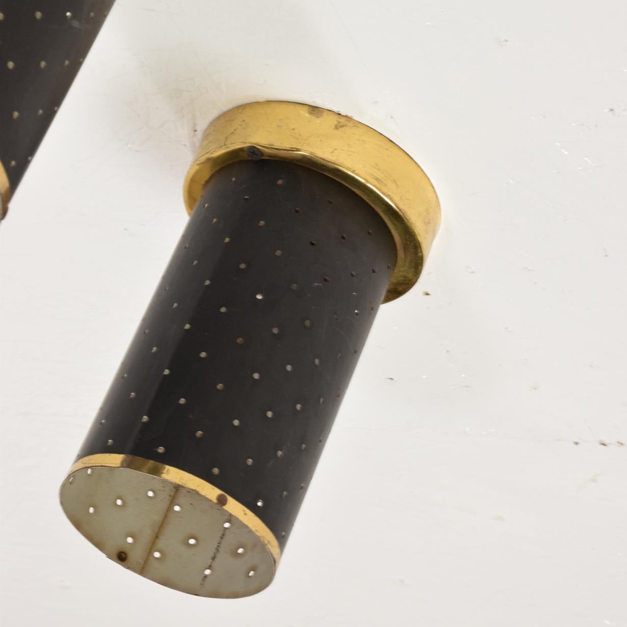 For your consideration, a Mid-Century Modern pair of wall or ceiling sconces in black and brass, Lightolier Era.


Made in the USA, circa 1960s. Unmarked, no information on the maker. Attributed to Lightolier.


Black steel with brass accents. The