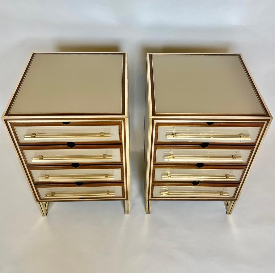 Four drawers with red velvet and brass details inside.
The drawers handles are solid brass bars.