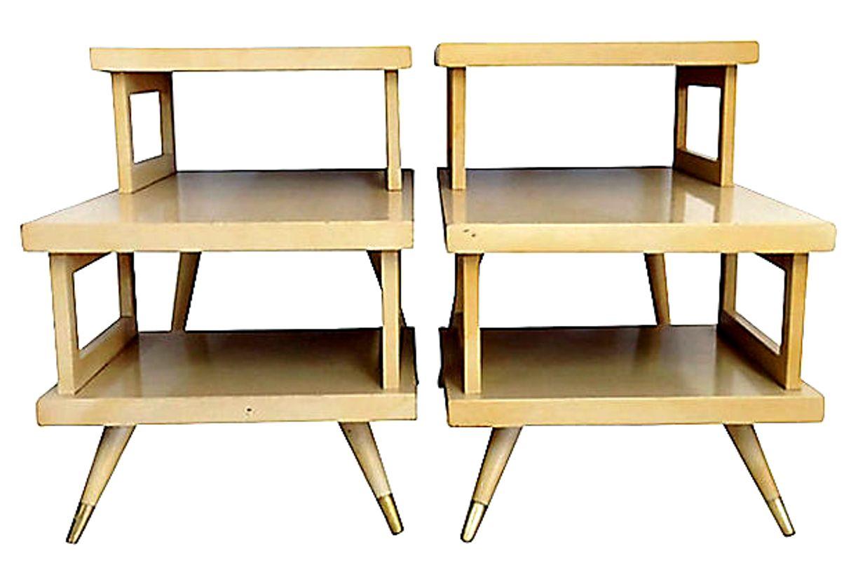 Mid-Century Modern pair of blonde wood and laminate three tier side tables with brass ferrule feet. Made of blonde wood, each top is laminated formica in high gloss finish.