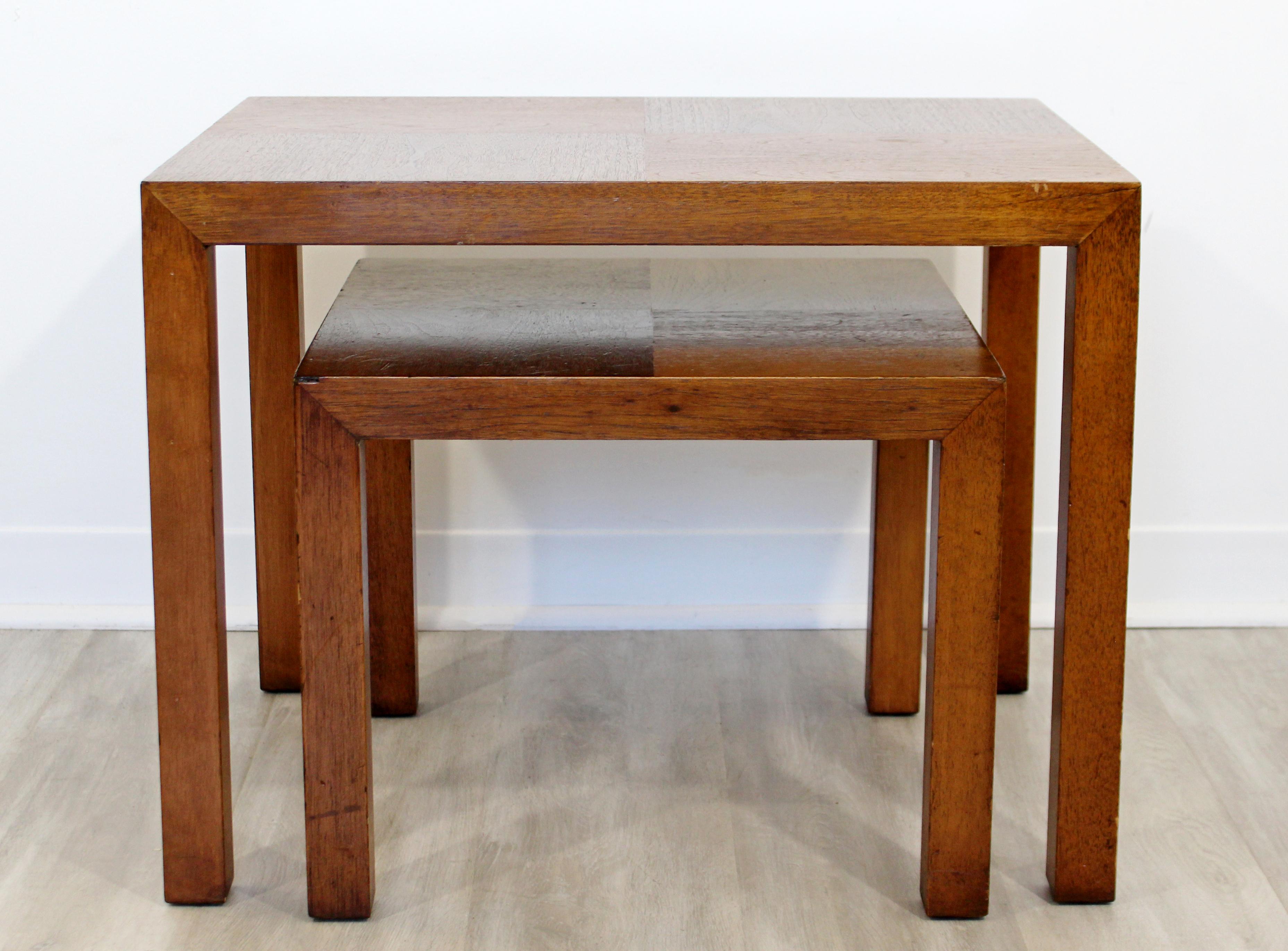 For your consideration is a neat pair of wood nesting tables that fit into one another, by Lane Altavista, circa 1960s. In very good vintage condition. The larger table measures 26