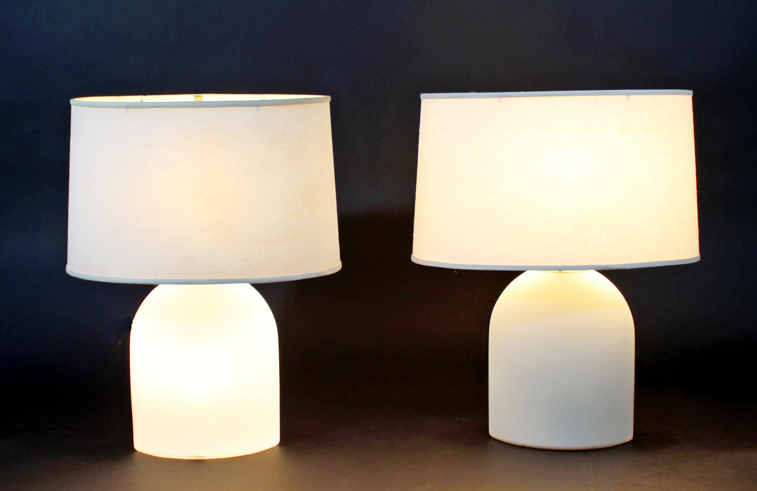 For your consideration is a stunning pair of white glass table lamps, with original shades and finials, by Peill and Putzler for Koch & Lowy, circa the 1970s. In excellent condition. The dimensions of the shades are 16