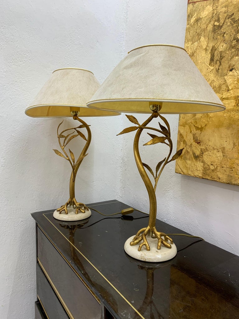 Gorgeous sculptural pair of Mid-Century Modern table lamps in gilt bronze and marble attributed to Designer Jacques Duval Brasseur, France, 1970s.
They are sold with their original lamp shades but these are not in the best condition with some tears