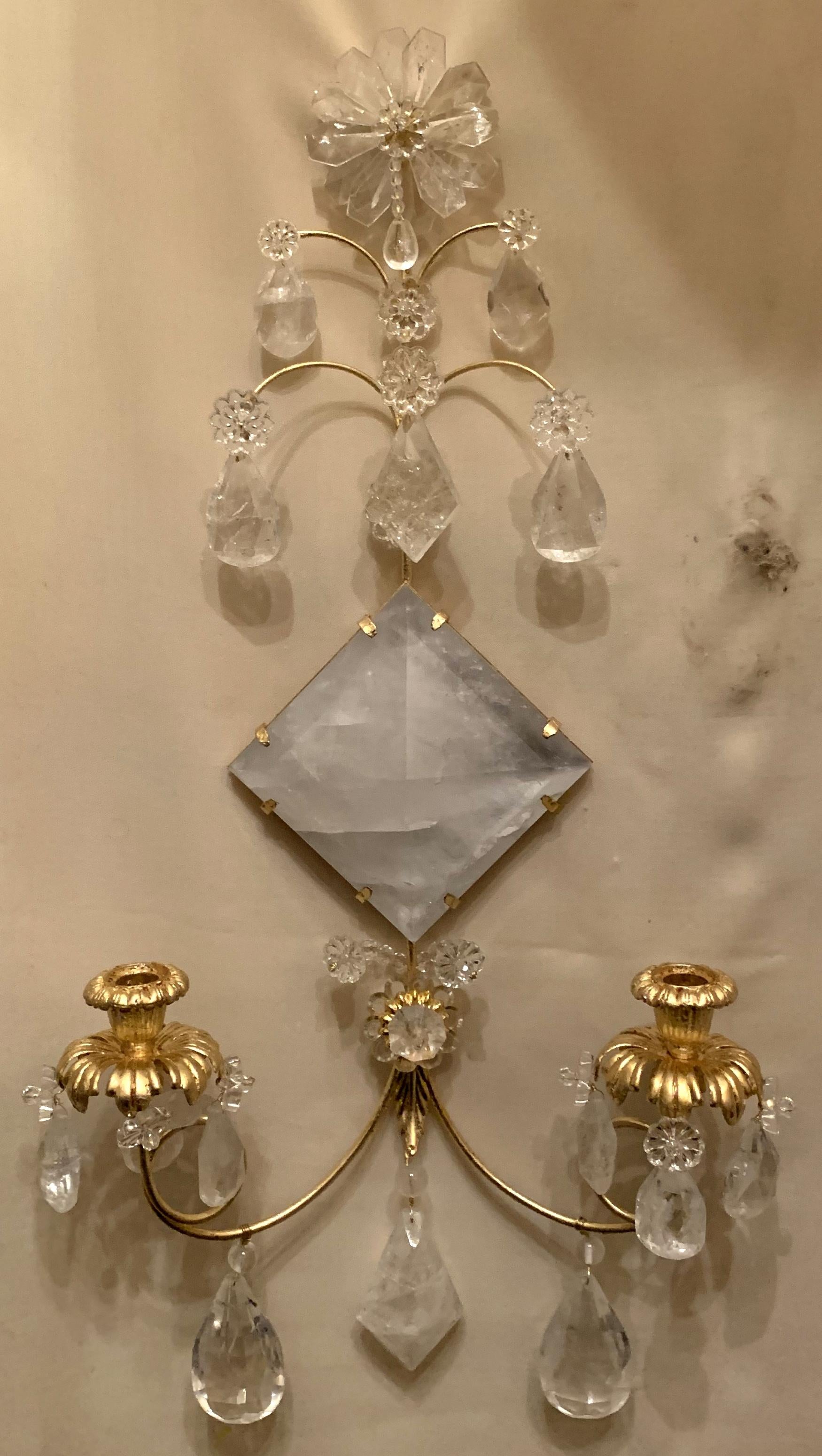 A wonderful Mid-Century Modern pair of transitional gold leaf and rock crystal sconces.
Also available in silver leaf.

Wiring is available.