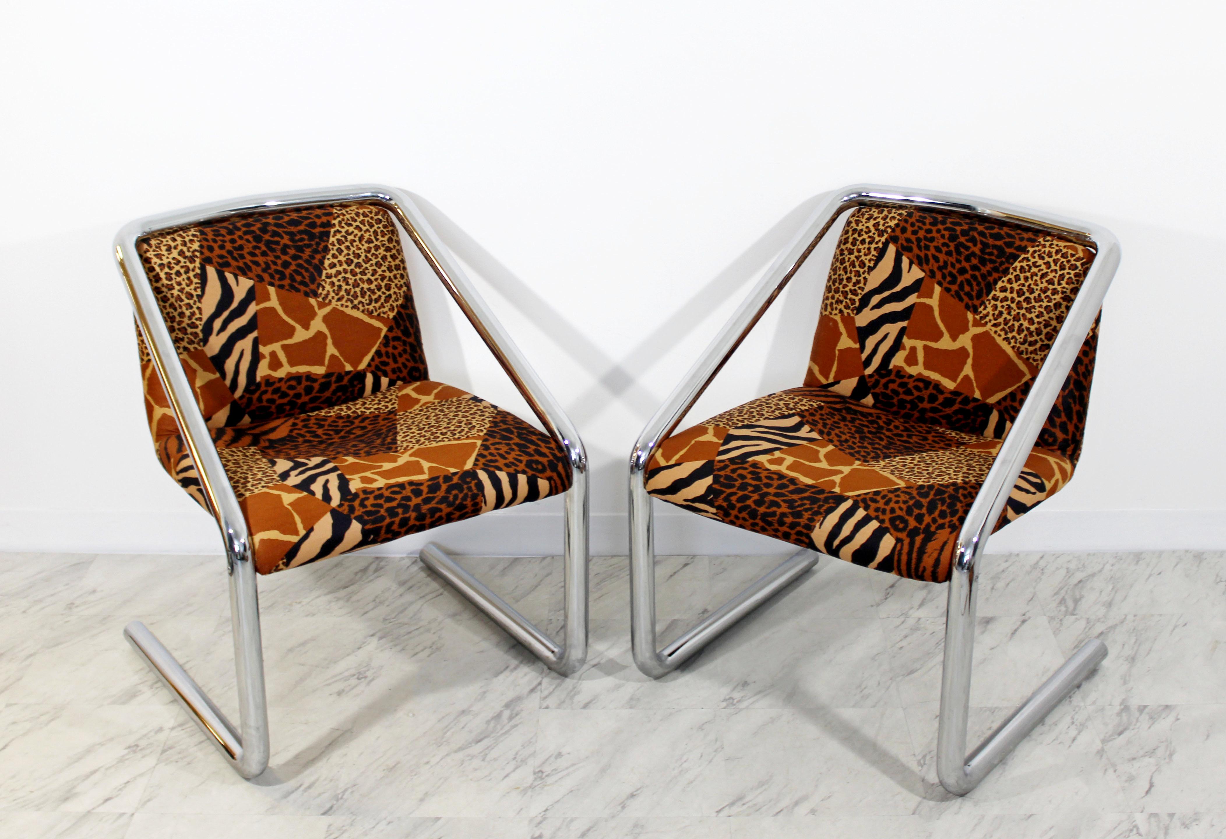 For your consideration is a fabulous pair of cantilever chairs, made of tubular chrome, with a funky cheetah print upholstery, circa the 1970s. In the style of John Mascheroni. In excellent condition. The dimensions are 23