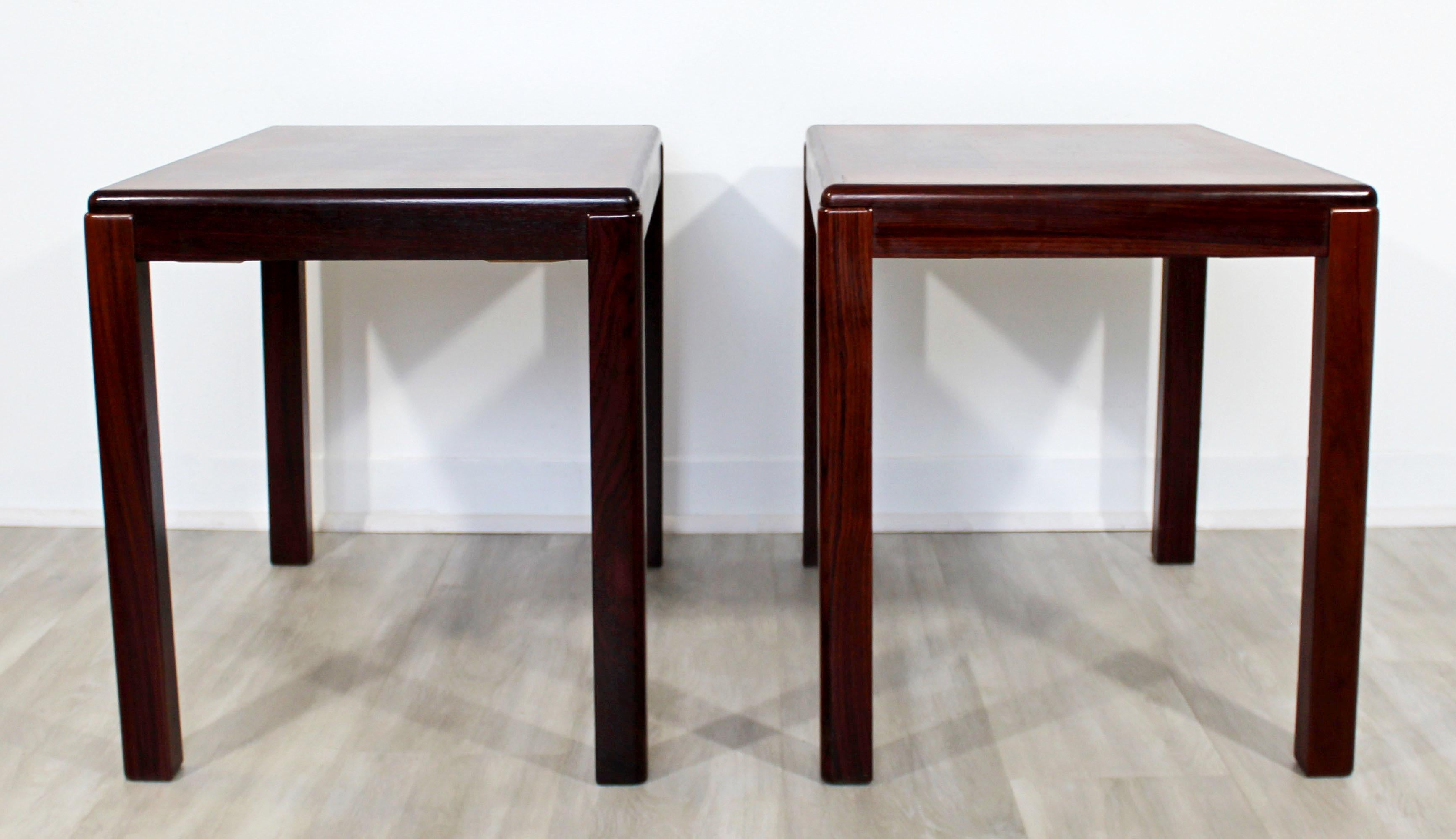 For your consideration is a ravishing pair of side or end tables, made of solid rosewood, by Vejle Stole Mobelfabrik, made in Denmark, circa 1970s. In very good vintage condition. The dimensions are 27.5
