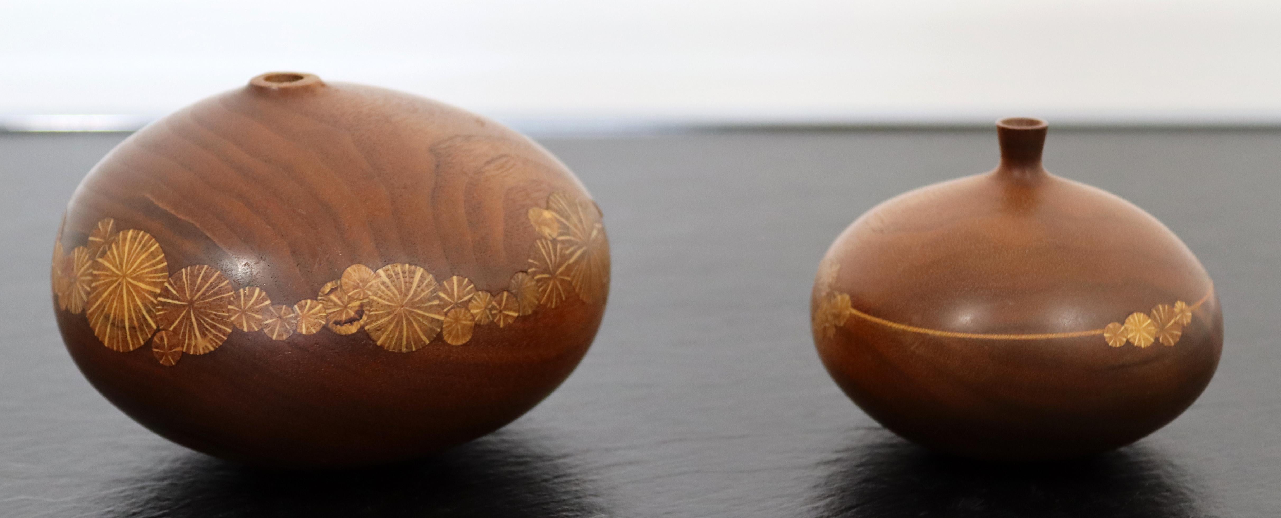 For your consideration is a lovely pair of wood vessels, with engraved floral patterns, signed by Roger Sloan, circa the 1970s. In excellent vintage condition. The dimensions are 4