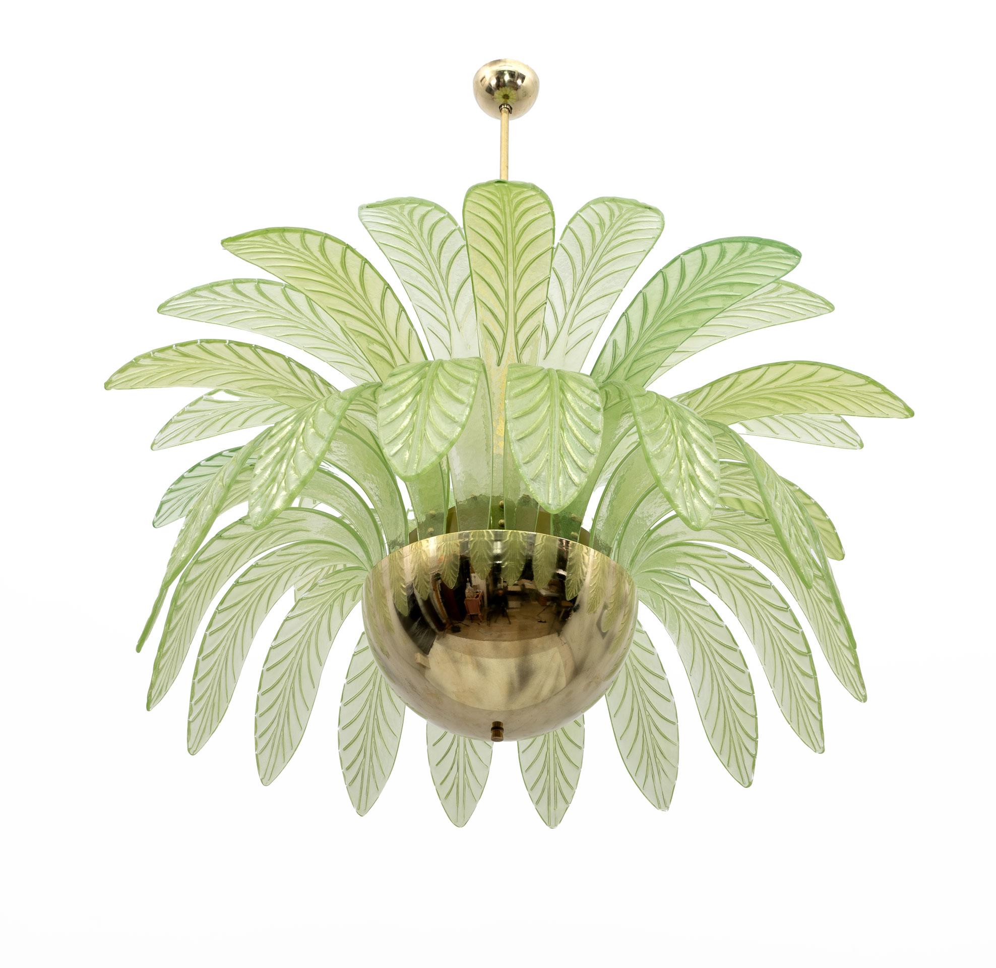 Large mouth-blown Murano glass chandelier, 38 green Murano glass leaves, brass structure, 12 bulbs. The chandelier reproduces the crown of a palm tree. We supply reducers for E12 USA bulbs. The minimum height, if you want to shorten the brass rod,